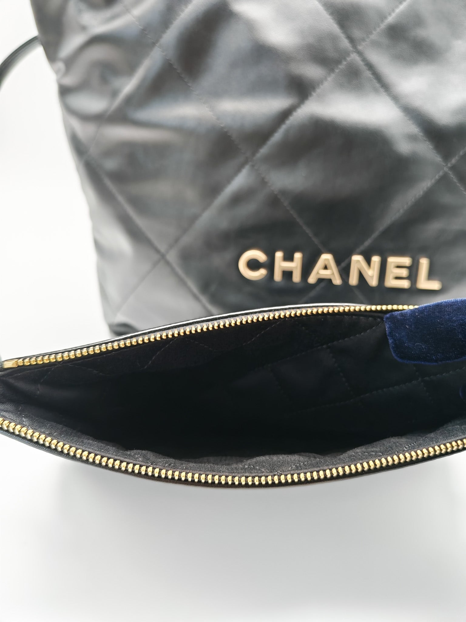 22 Small in Black Quilted Shiny Calfskin Leather and Aged Gold Hardware (Microchip) | Purse Maison Luxury Bags Shop