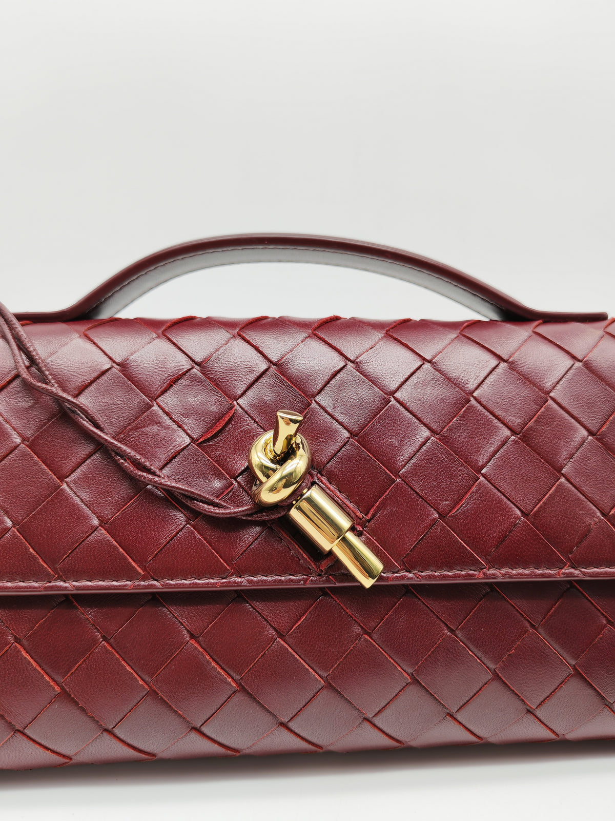 Bottega Veneta Andiamo Clutch in Barolo Woven Intrecciato Lambskin Leather and Gold Hardware