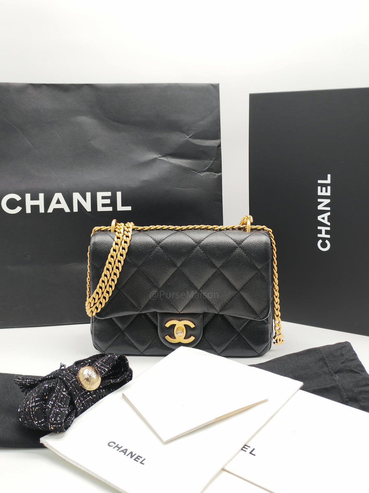 Chanel Mini Rectangular Flap Bag in Black Quilted Caviar Leather and Aged Gold Hardware Microchip