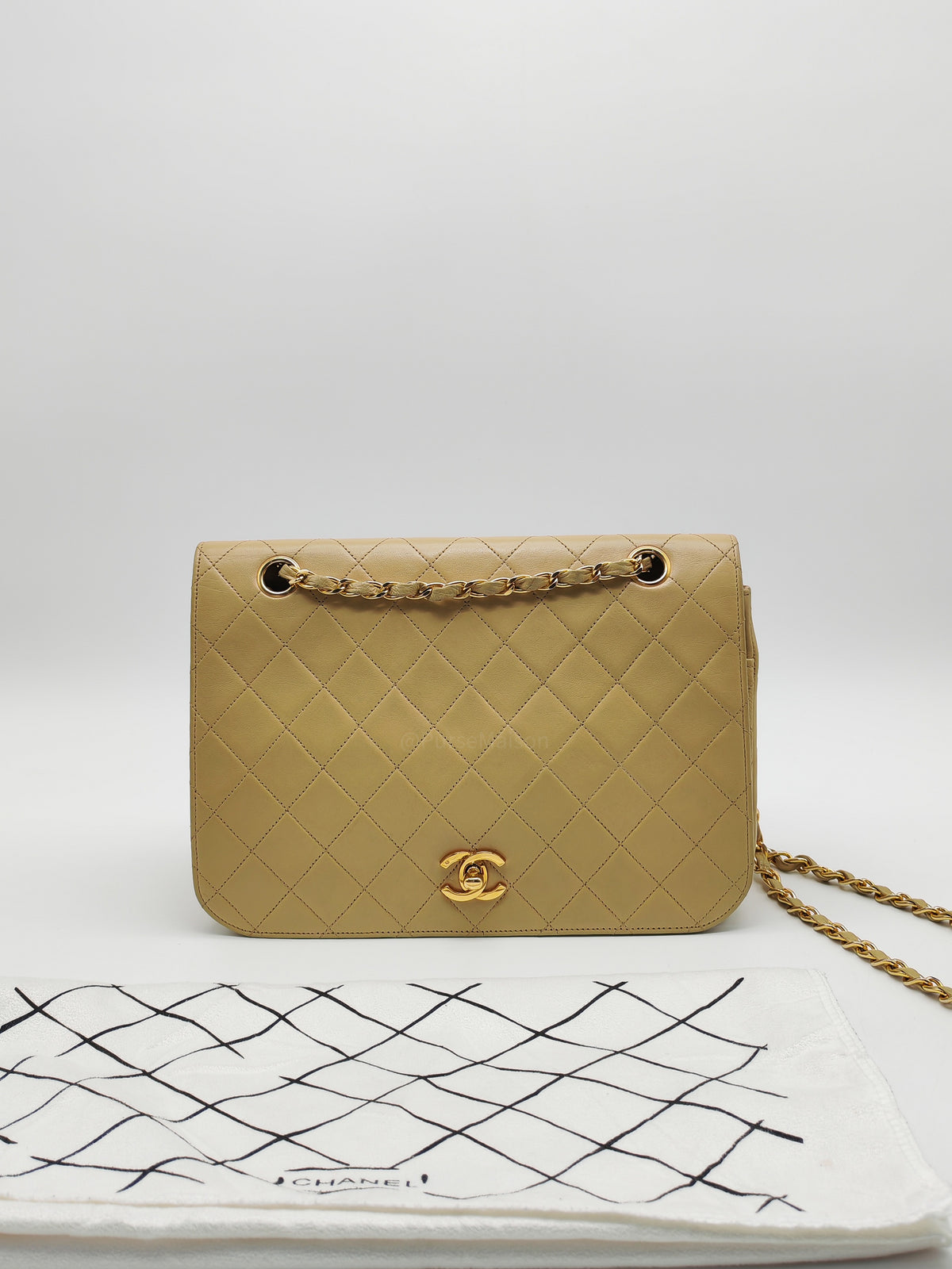 Chanel Vintage Timeless Classic Flap Bag in Beige Quilted Lambskin Leather and Gold Hardware Series 1