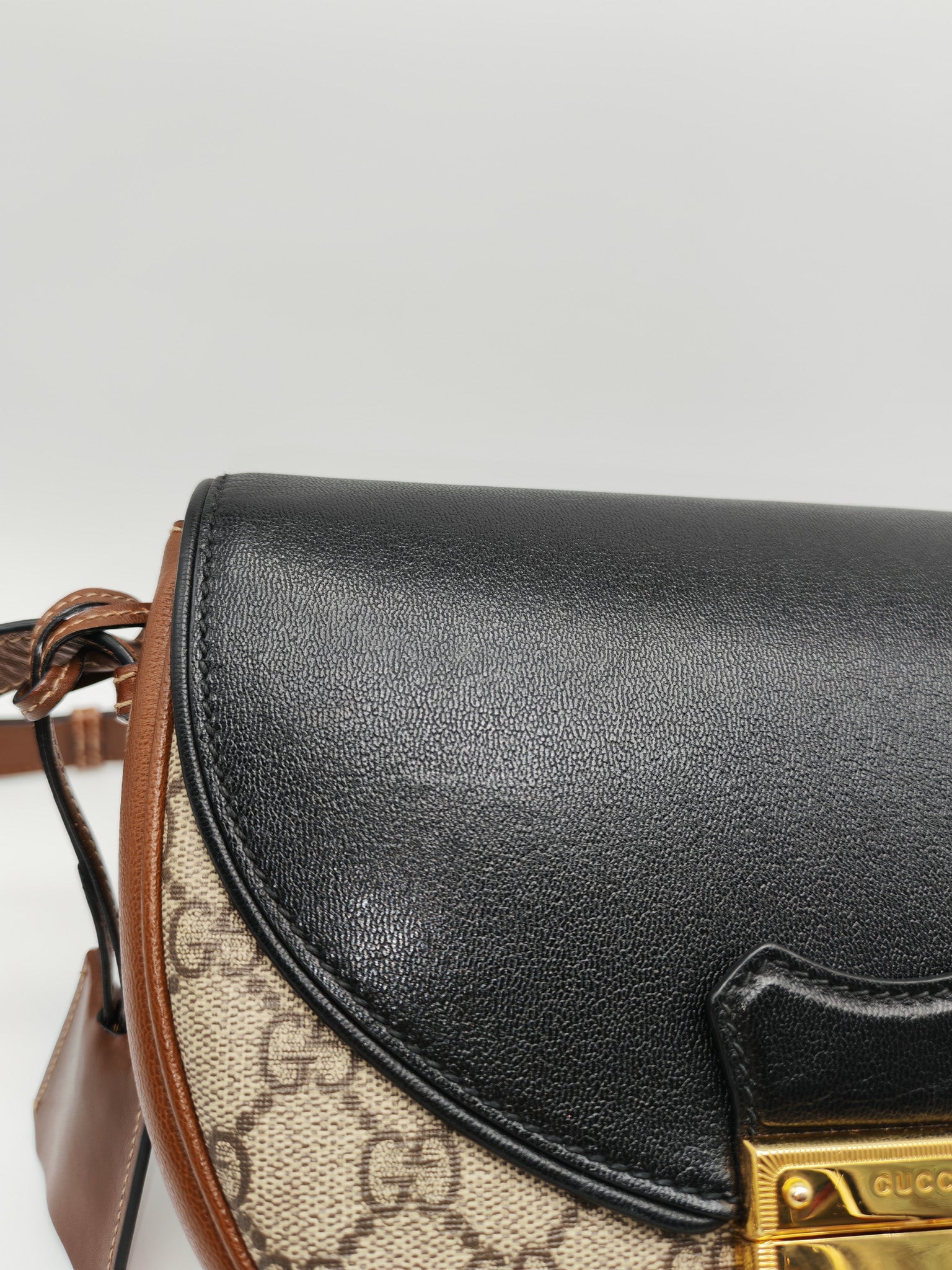 Gucci Padlock Saddle Bag in GG Supreme Monogram Canvas and Gold Hardware