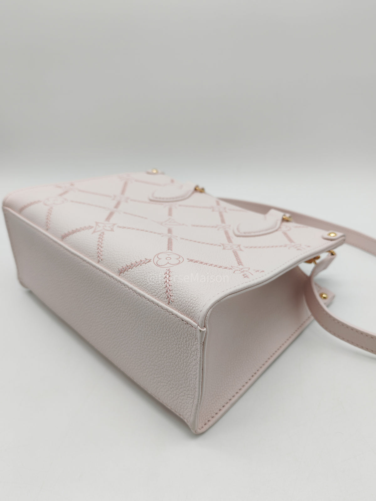 Louis Vuitton OnTheGo PM in Pale Pink Monogram Empreinte Couture Cowhide Leather and Gold Hardware Microchip