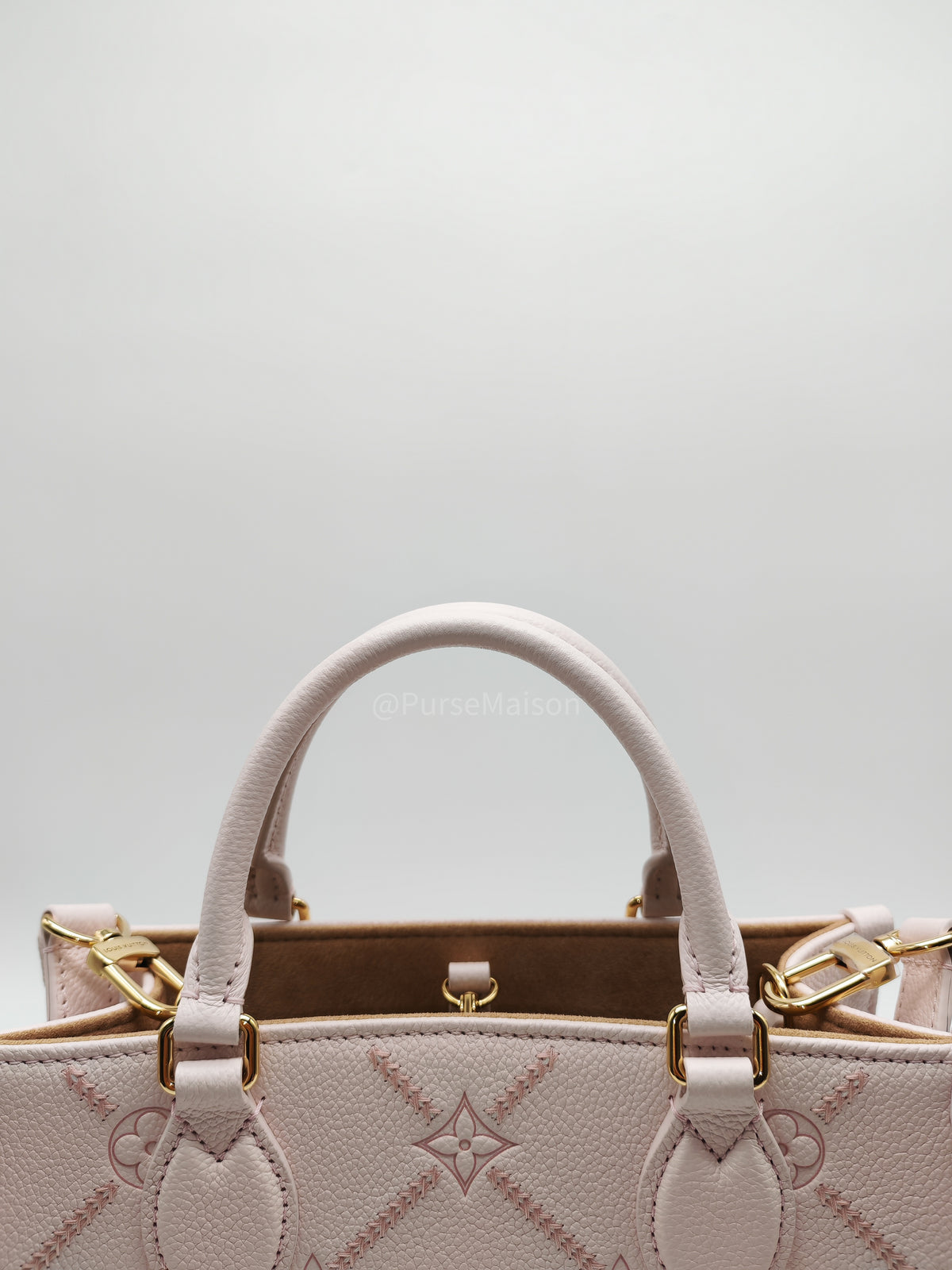 Louis Vuitton OnTheGo PM in Pale Pink Monogram Empreinte Couture Cowhide Leather and Gold Hardware Microchip