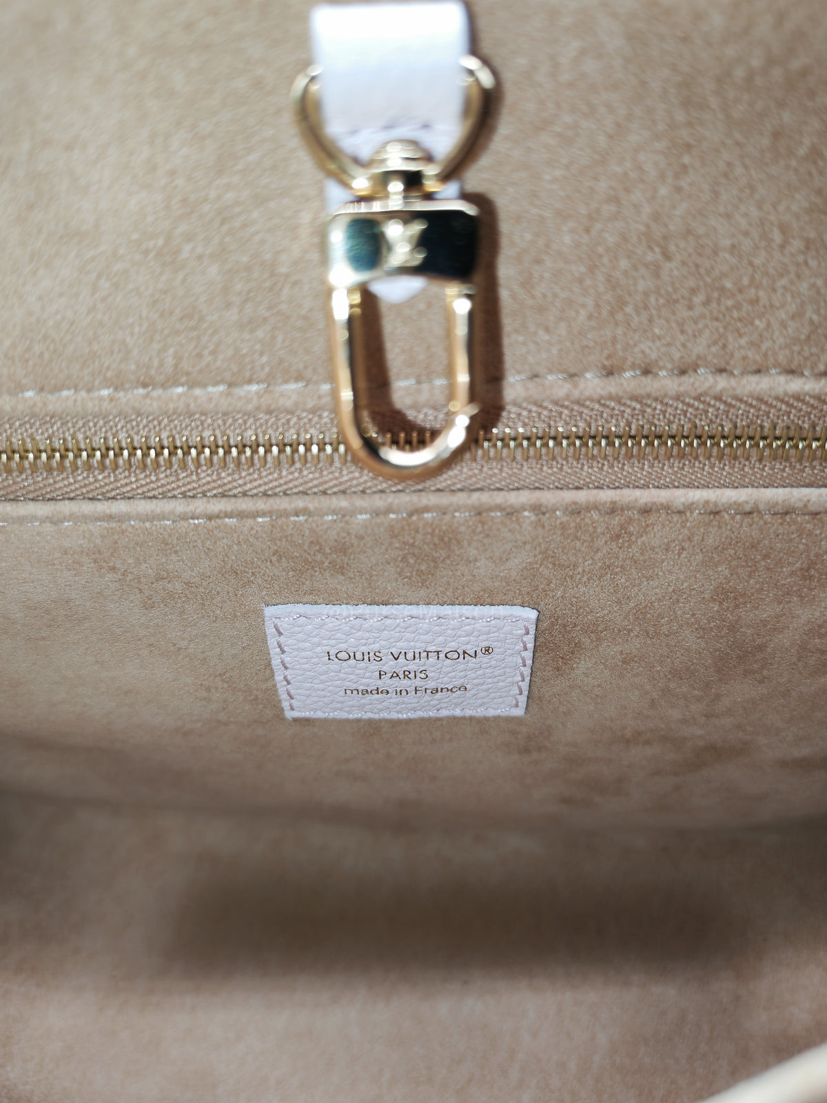 Louis Vuitton OnTheGo PM in Pale Pink Monogram Empreinte Couture Cowhide Leather and Gold Hardware Microchip