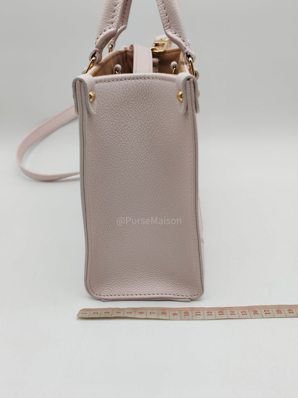 Louis Vuitton OnTheGo PM in Pale Pink Monogram Empreinte Couture Cowhide Leather and Gold Hardware Microchip