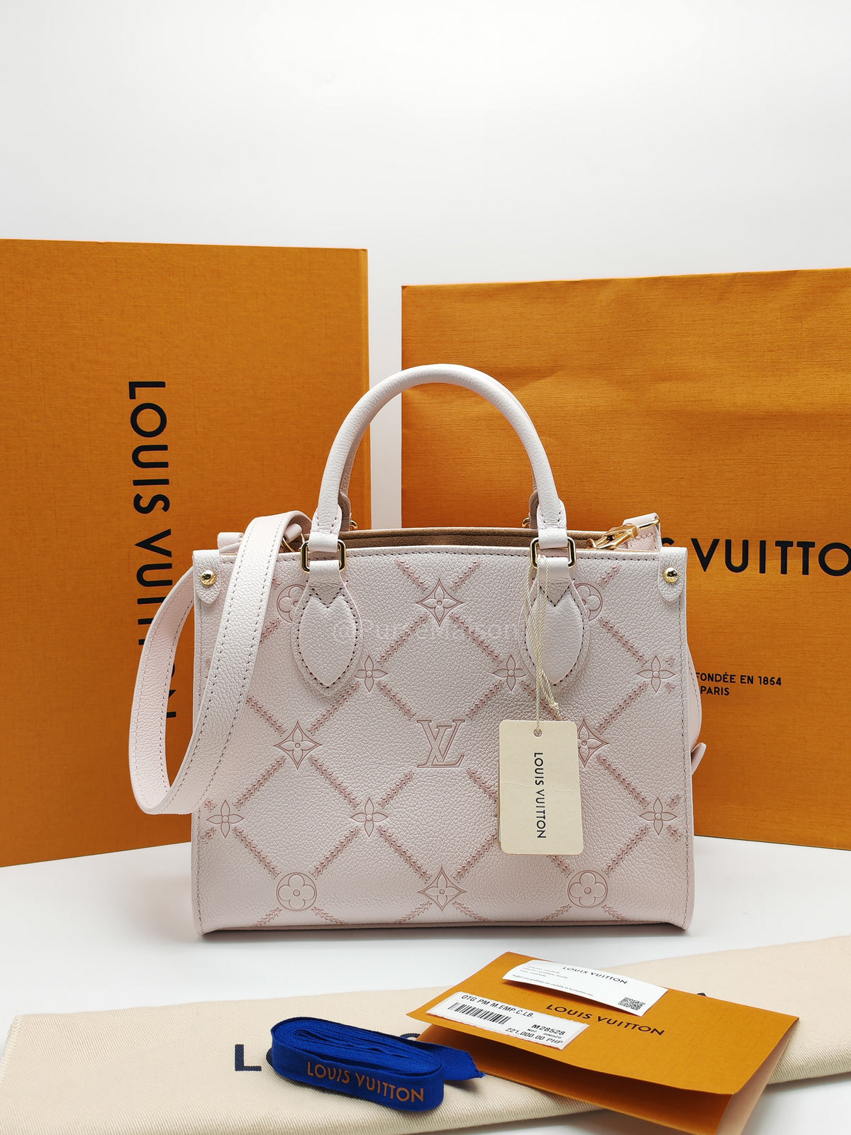 Louis Vuitton OnTheGo PM in Pale Pink Monogram Empreinte Couture Cowhide Leather and Gold Hardware Microchip