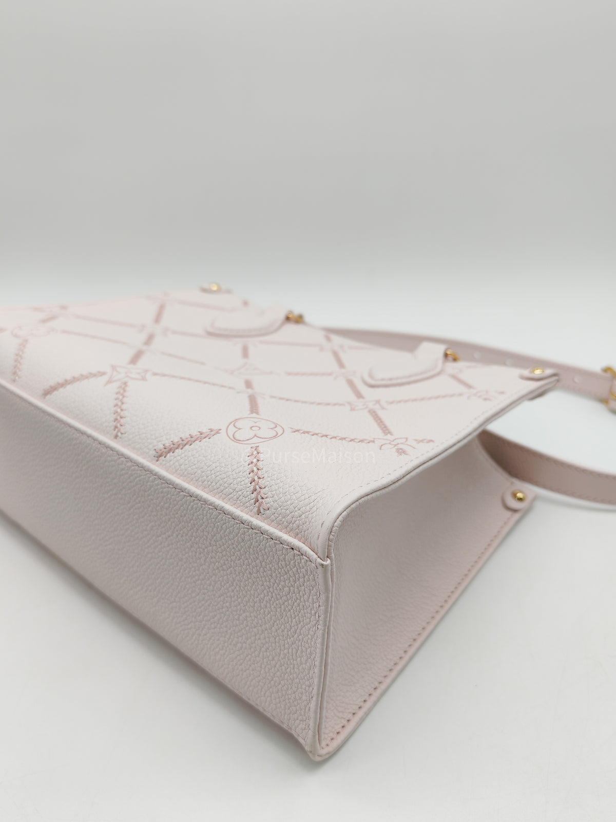 Louis Vuitton OnTheGo PM in Pale Pink Monogram Empreinte Couture Cowhide Leather and Gold Hardware Microchip
