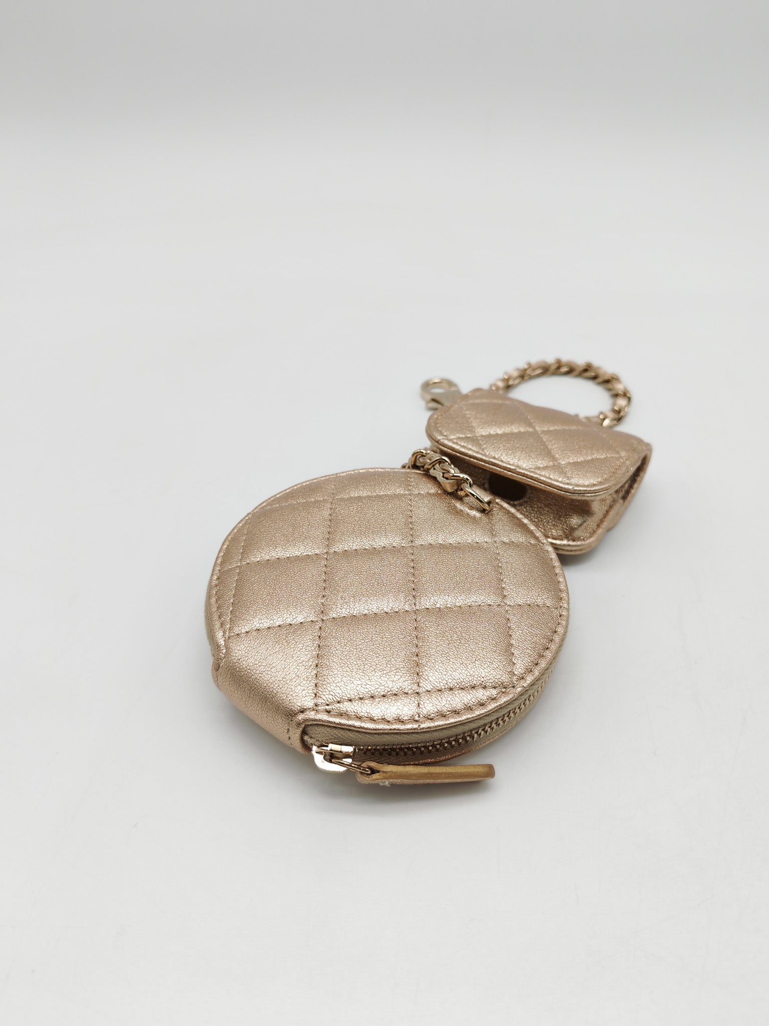 Chanel Round Clip-on Coin Purse and Airpods Case Set in Metallic Gold Quilted Lambskin Leather and Light Gold Hardware Microchip | Purse Maison Luxury Bags Shop