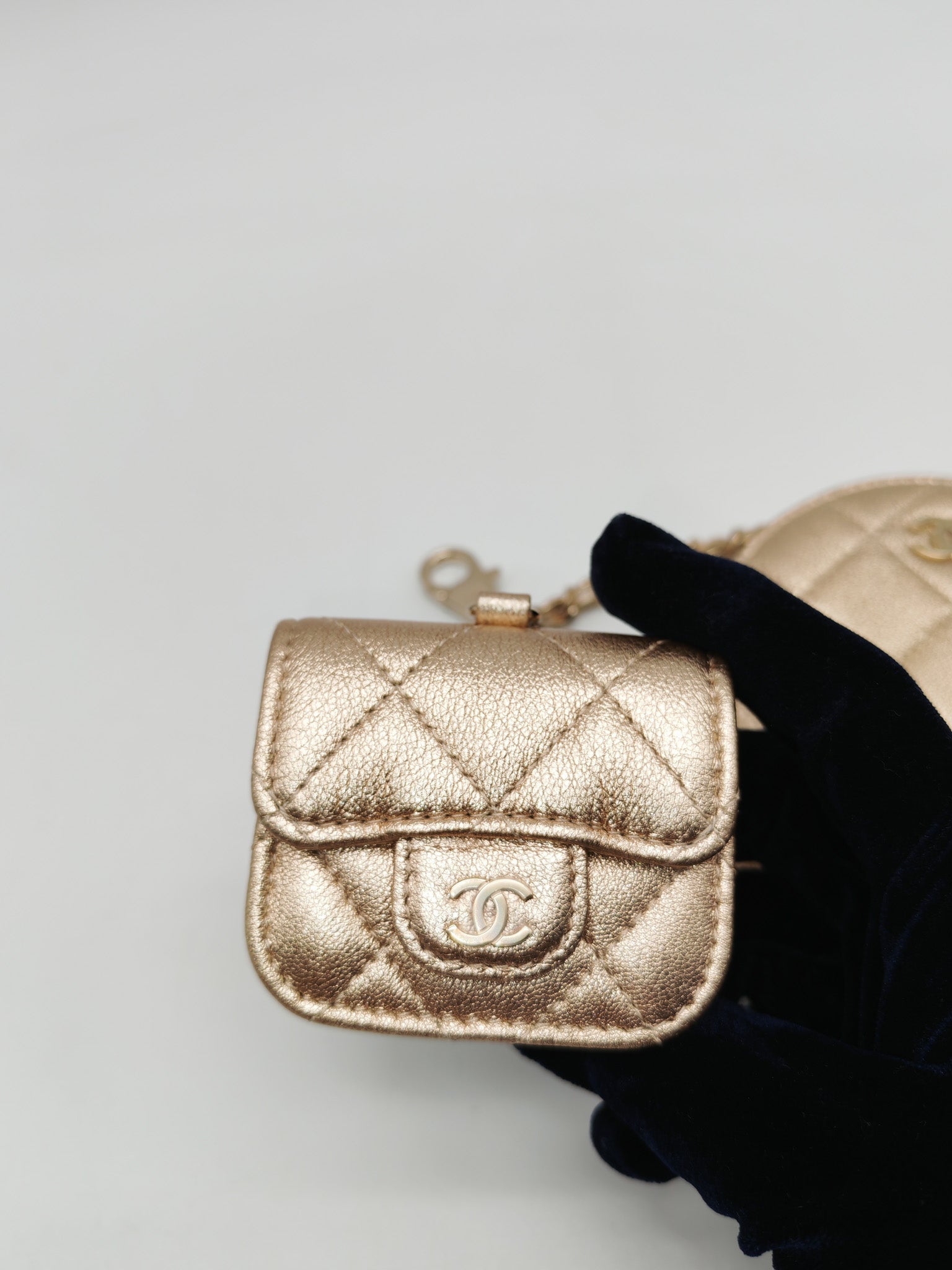 Chanel Round Clip-on Coin Purse and Airpods Case Set in Metallic Gold Quilted Lambskin Leather and Light Gold Hardware Microchip | Purse Maison Luxury Bags Shop