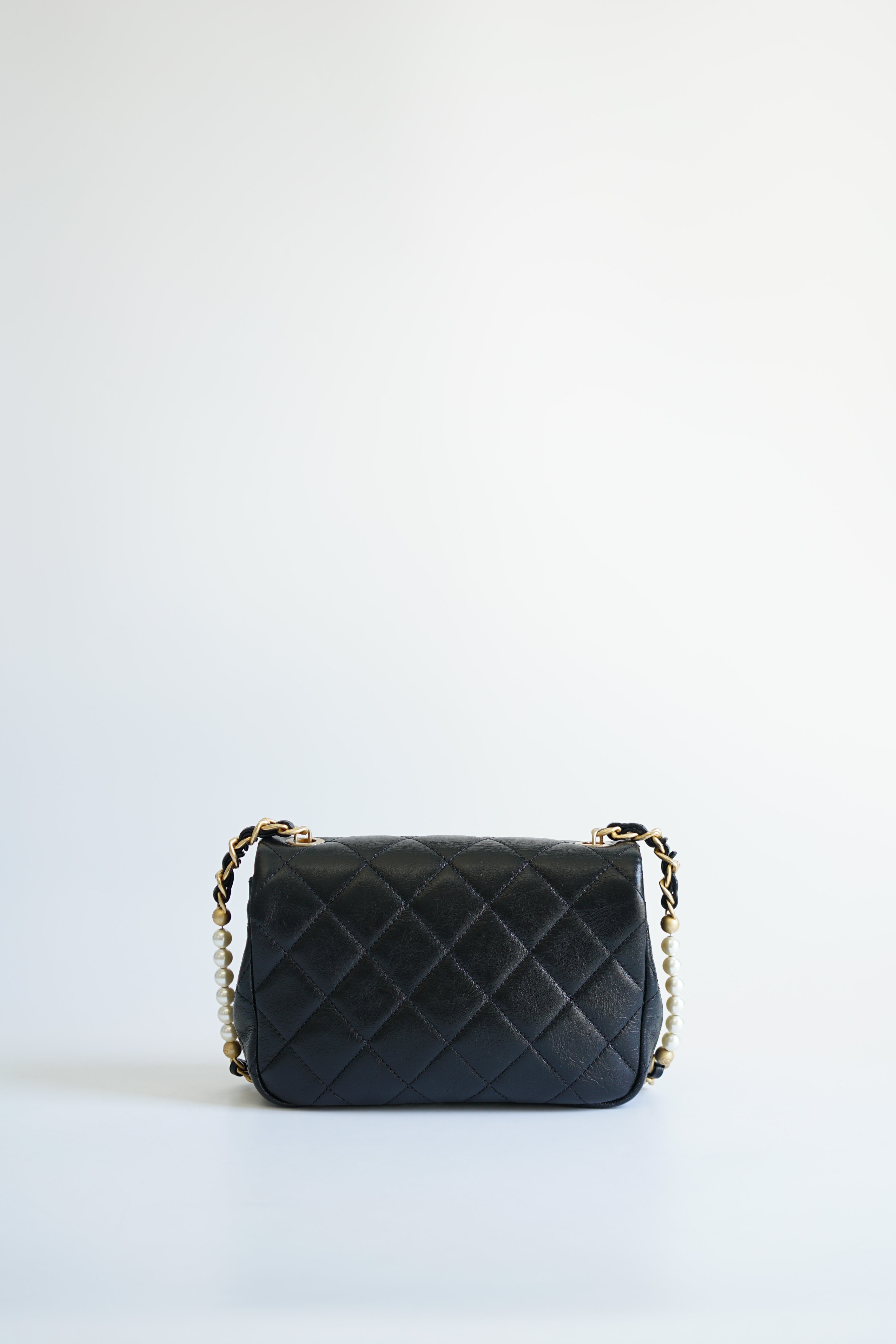 Chanel Seasonal Mini Flap Pearl CC and Chain in Black Calfskin and Aged Gold Hardware (Microchip)