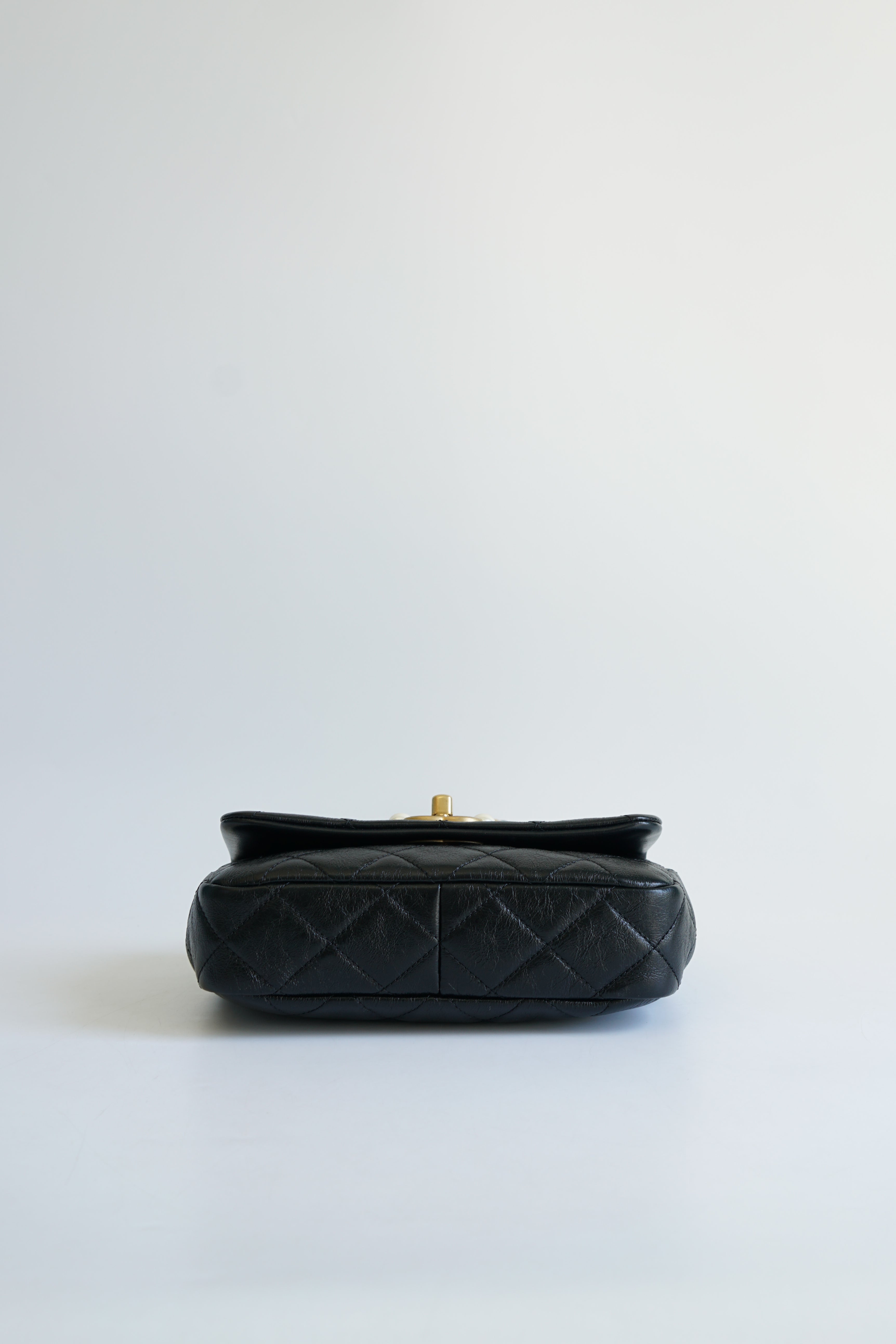 Chanel Seasonal Mini Flap Pearl CC and Chain in Black Calfskin and Aged Gold Hardware (Microchip)
