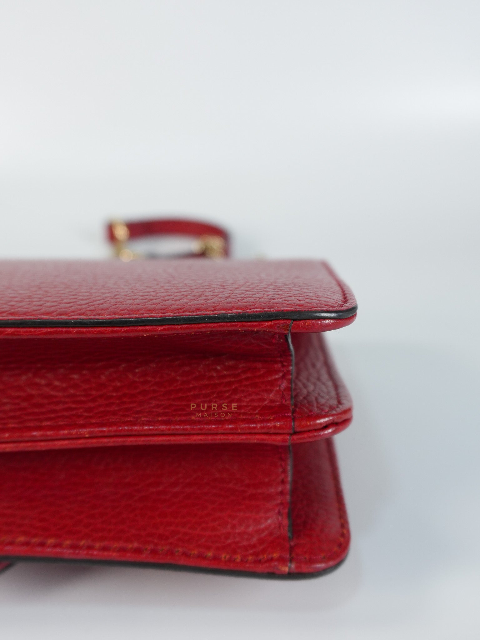 Interlocking G Dollar in Red Grained Calfskin Leather | Purse Maison Luxury Bags Shop