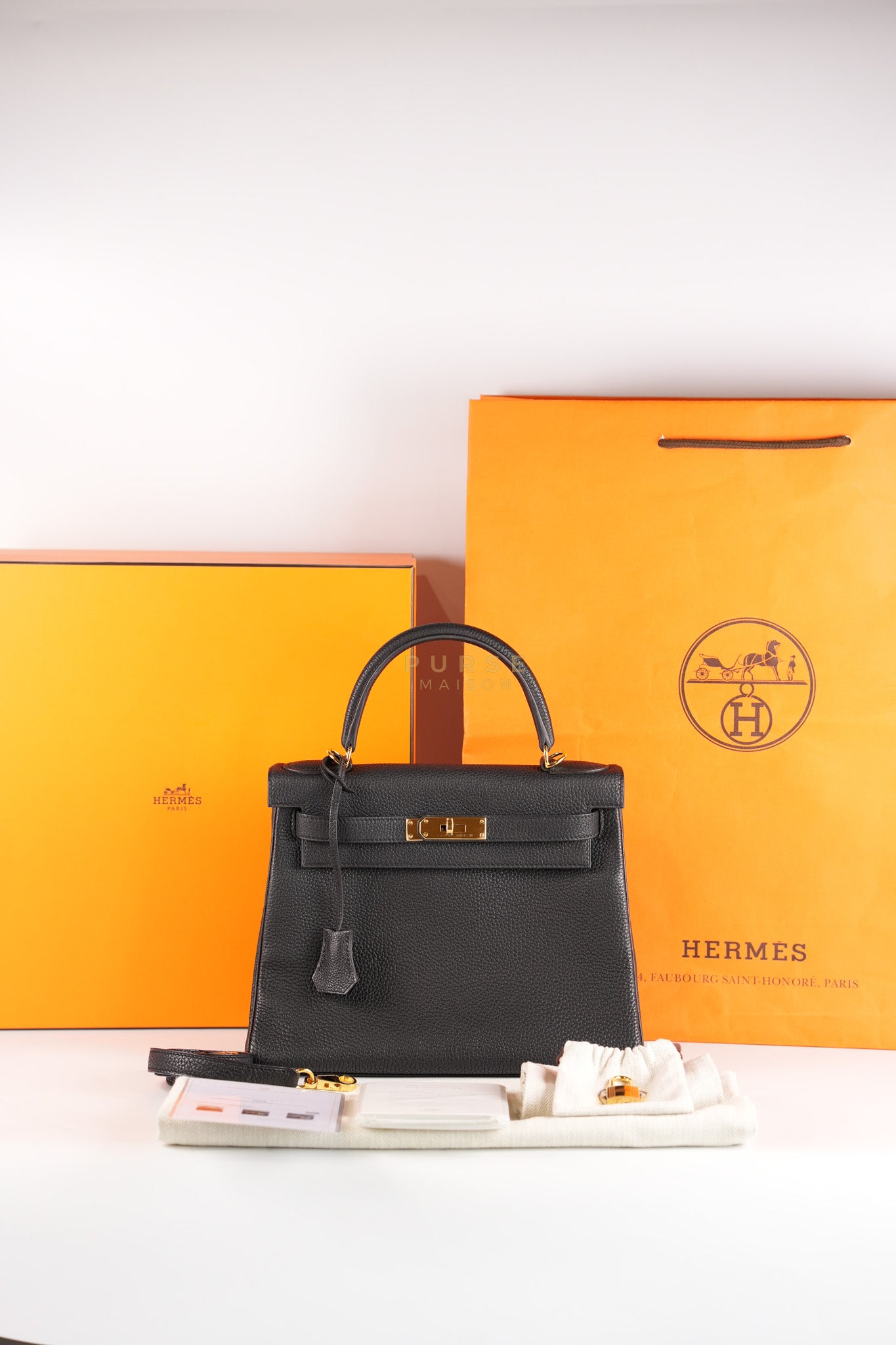 Kelly 28 Retourne in Black Togo Leather in Gold Hardware Stamp X (2016) | Purse Maison Luxury Bags Shop