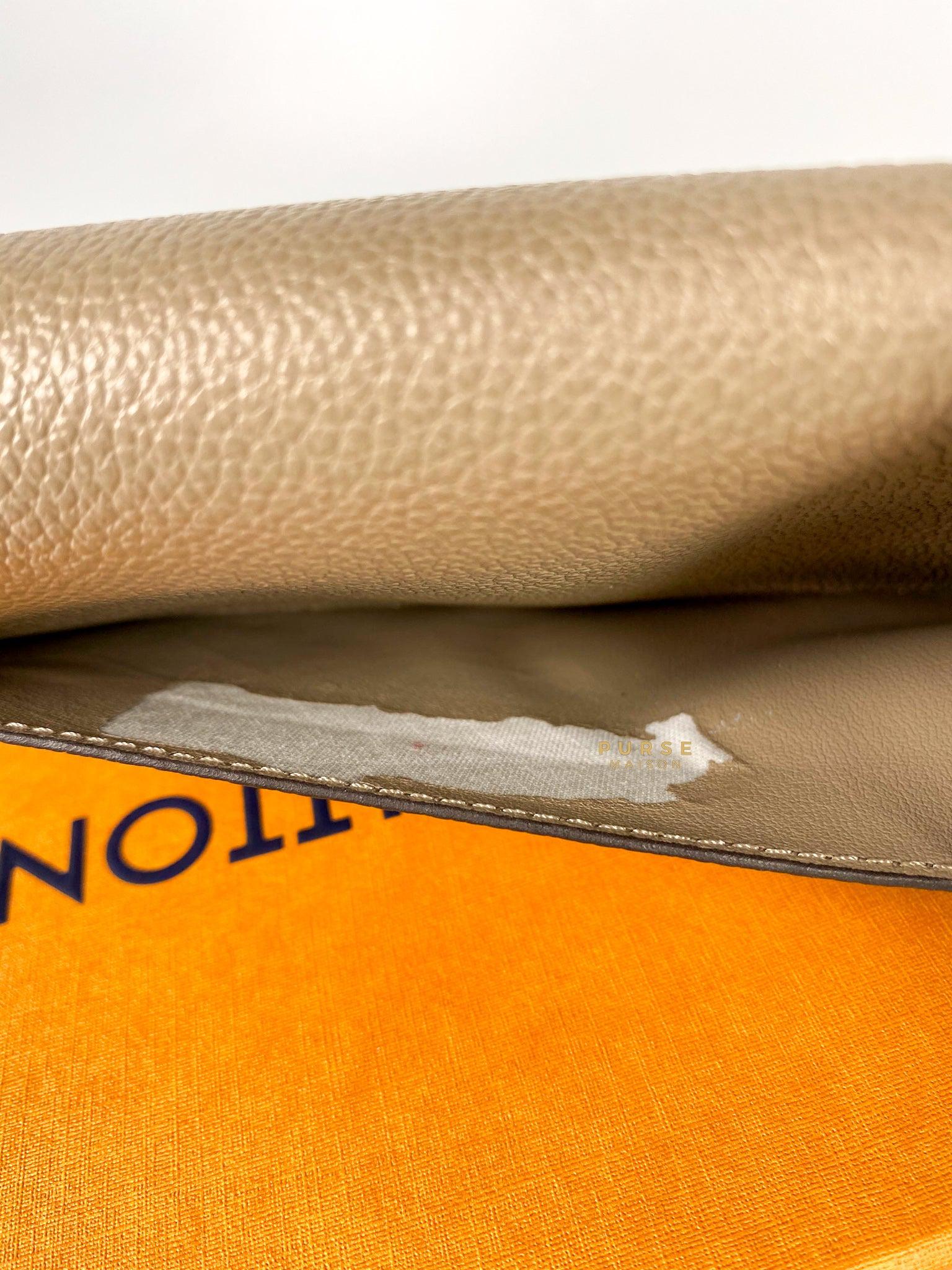 Louis Vuitton Sarah Wallet in Turtledove Monogram Empreinte Canvas (microchip)