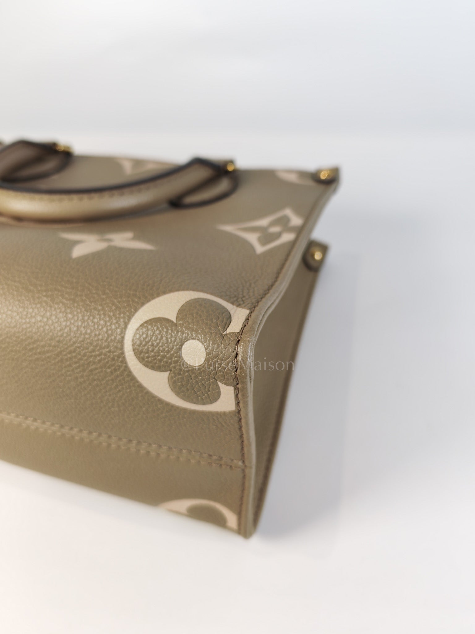 On The Go PM (OTG) in Tourterelle Creme in Monogram Empreinte Leather (Microchip) | Purse Maison Luxury Bags Shop