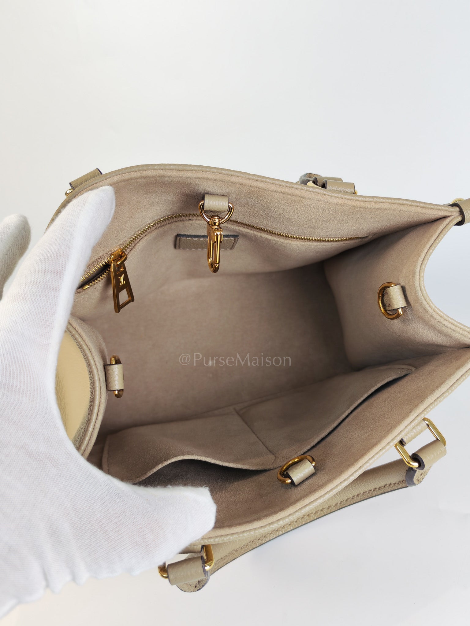 On The Go PM (OTG) in Tourterelle Creme in Monogram Empreinte Leather (Microchip) | Purse Maison Luxury Bags Shop