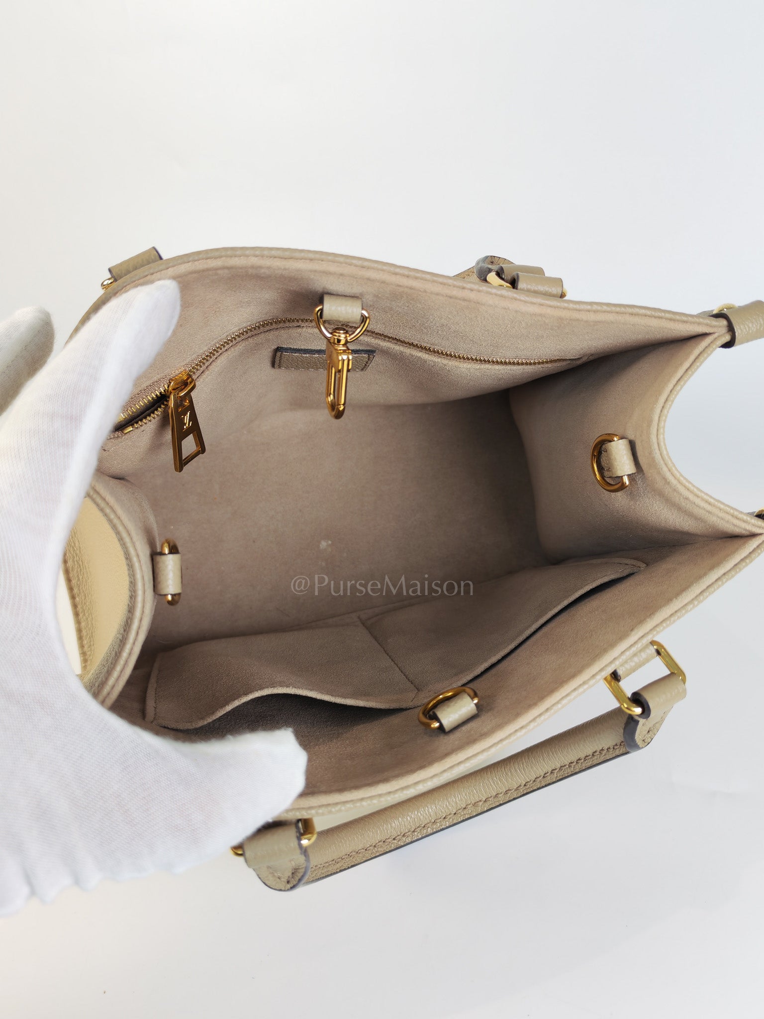 On The Go PM (OTG) in Tourterelle Creme in Monogram Empreinte Leather (Microchip) | Purse Maison Luxury Bags Shop