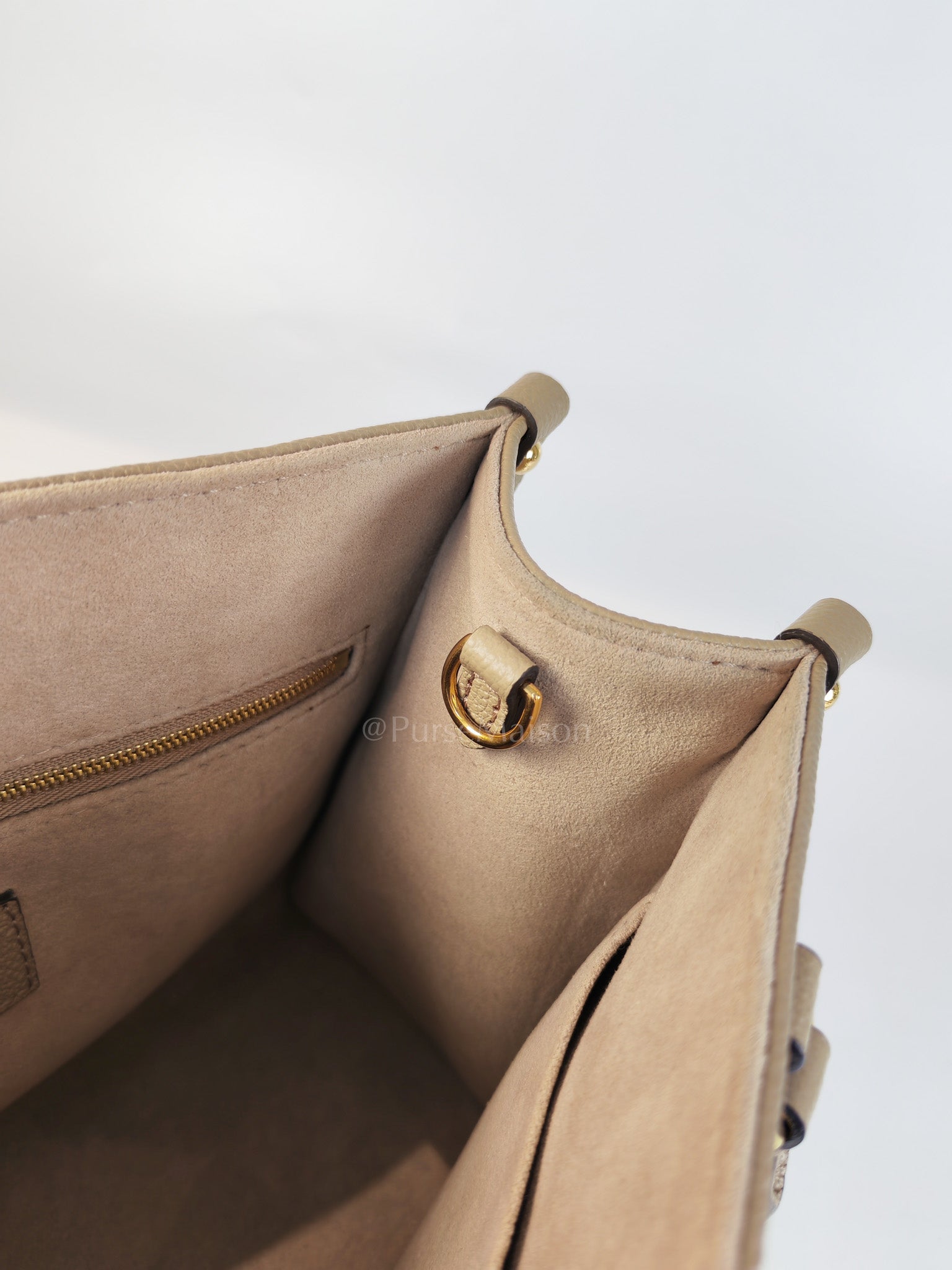 On The Go PM (OTG) in Tourterelle Creme in Monogram Empreinte Leather (Microchip) | Purse Maison Luxury Bags Shop