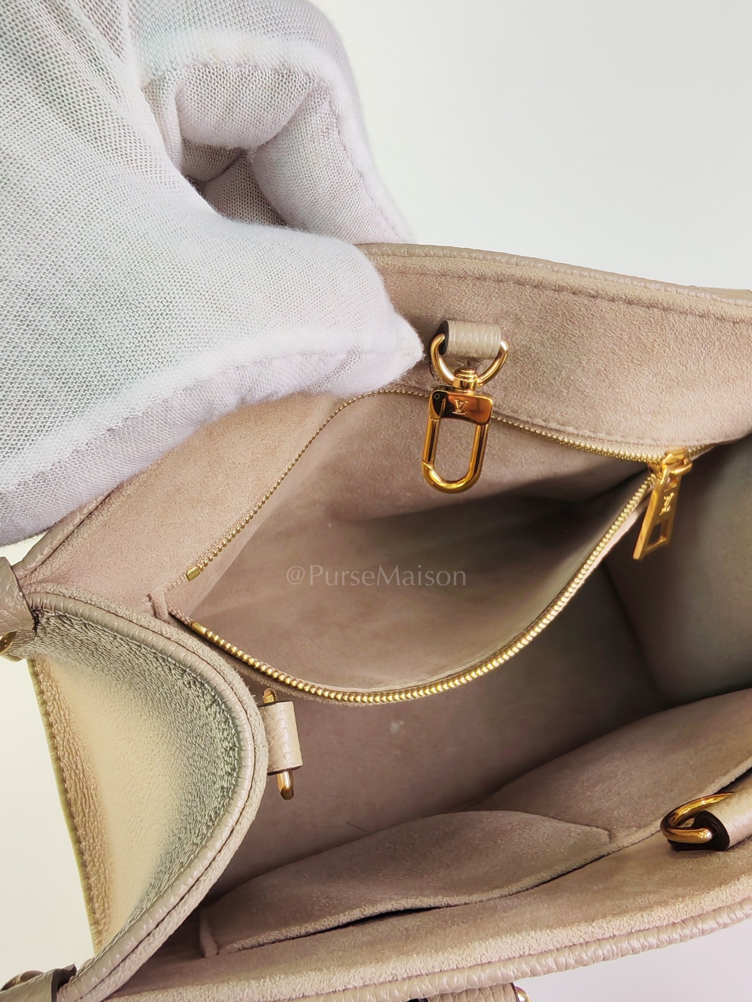 On The Go PM (OTG) in Tourterelle Creme in Monogram Empreinte Leather (Microchip) | Purse Maison Luxury Bags Shop