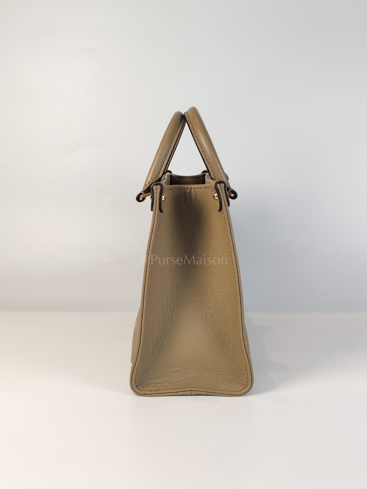 On The Go PM (OTG) in Tourterelle Creme in Monogram Empreinte Leather (Microchip) | Purse Maison Luxury Bags Shop