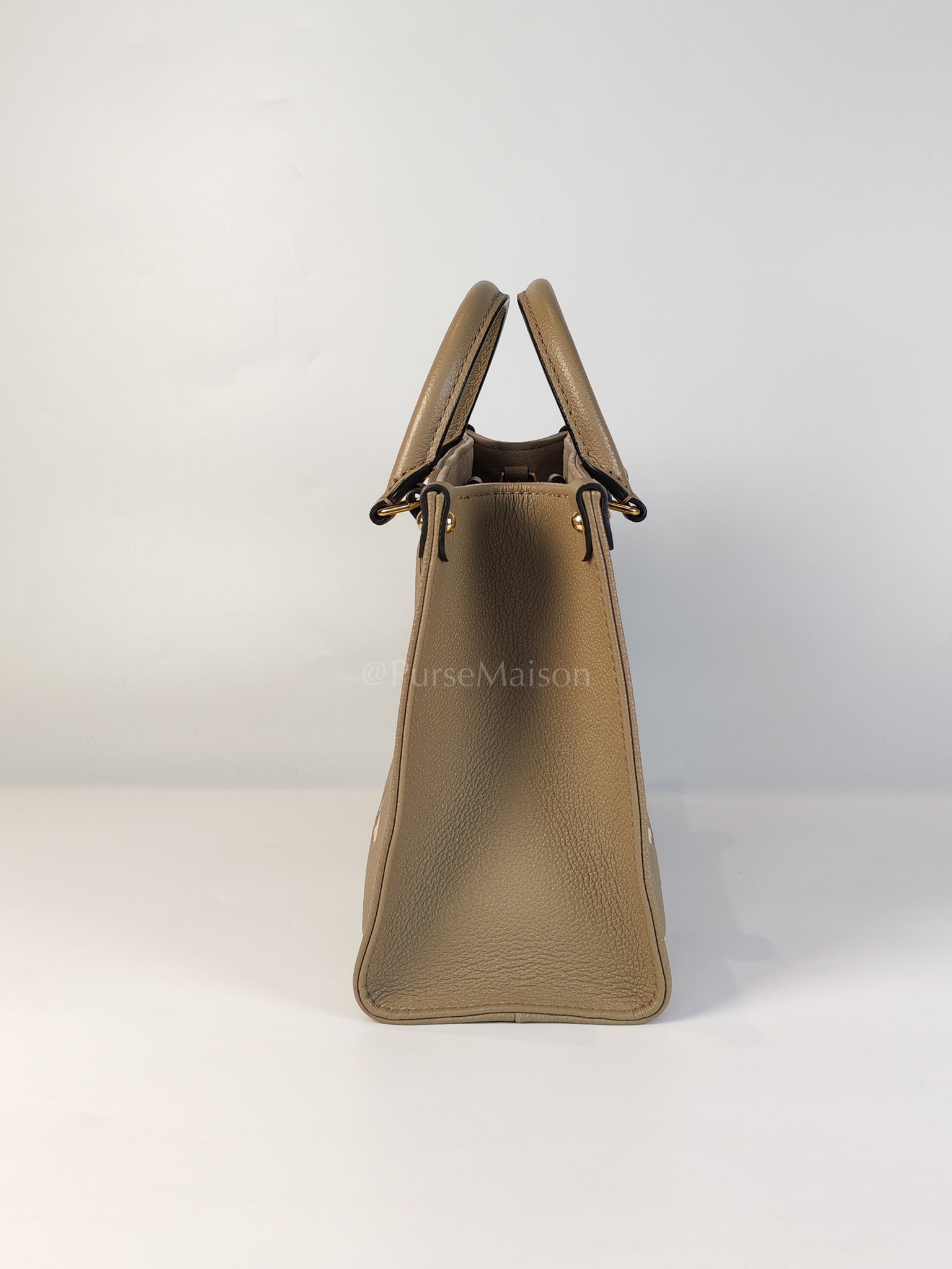 On The Go PM (OTG) in Tourterelle Creme in Monogram Empreinte Leather (Microchip) | Purse Maison Luxury Bags Shop