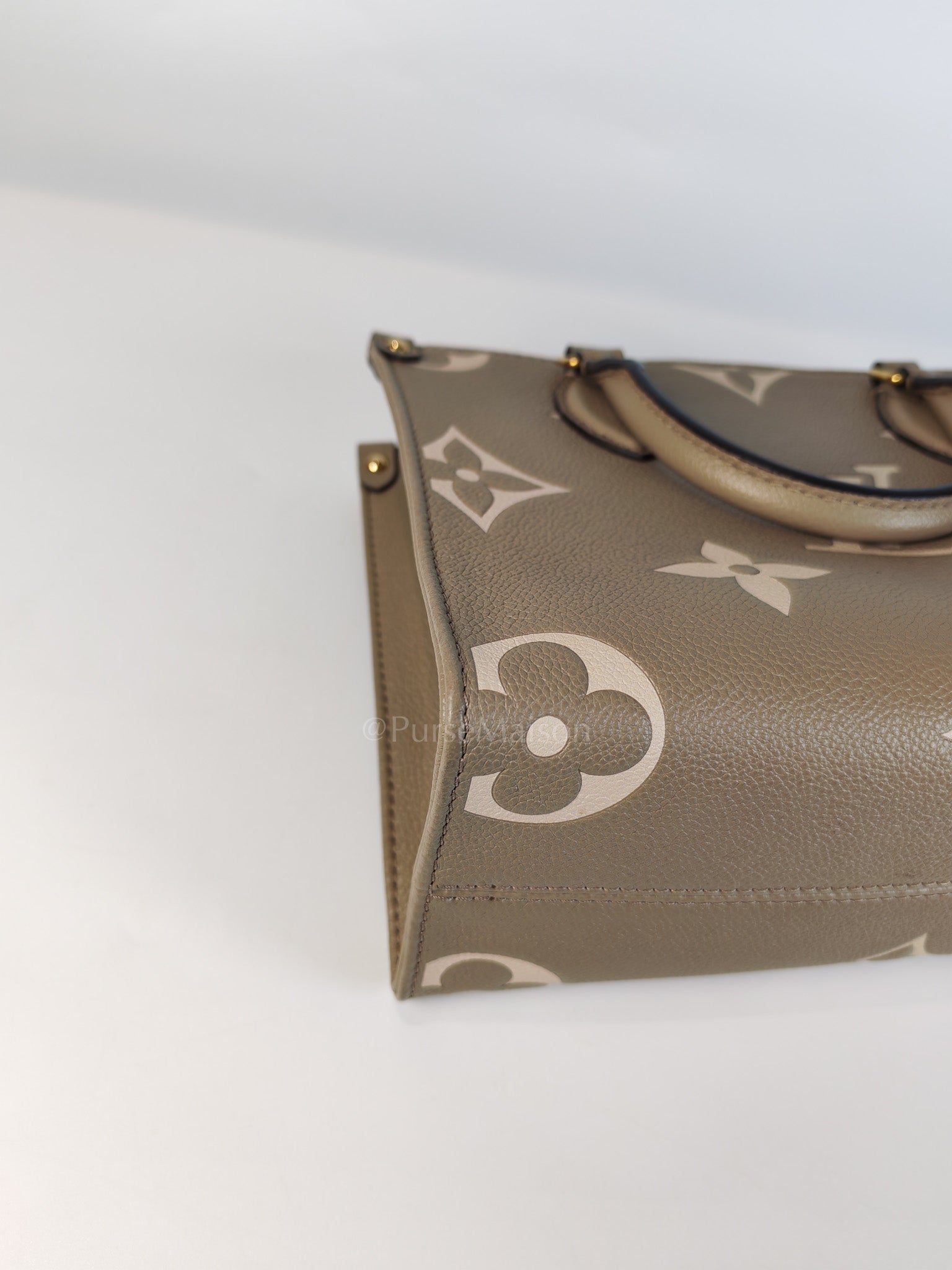 On The Go PM (OTG) in Tourterelle Creme in Monogram Empreinte Leather (Microchip) | Purse Maison Luxury Bags Shop