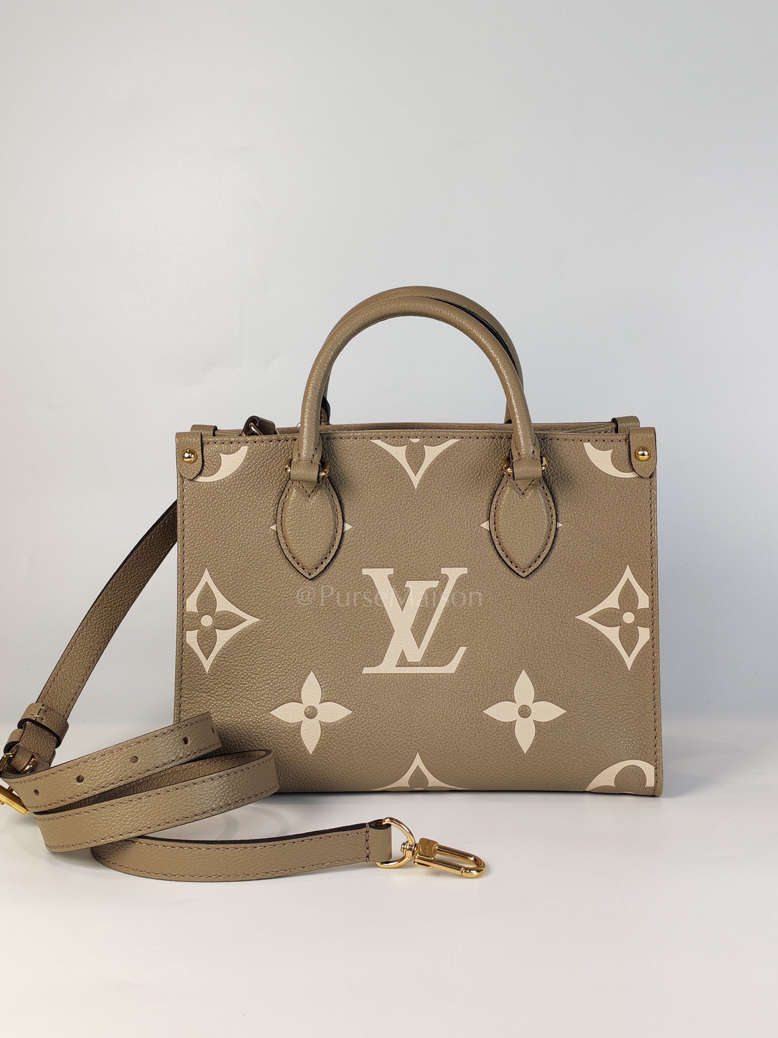 On The Go PM (OTG) in Tourterelle Creme in Monogram Empreinte Leather (Microchip) | Purse Maison Luxury Bags Shop