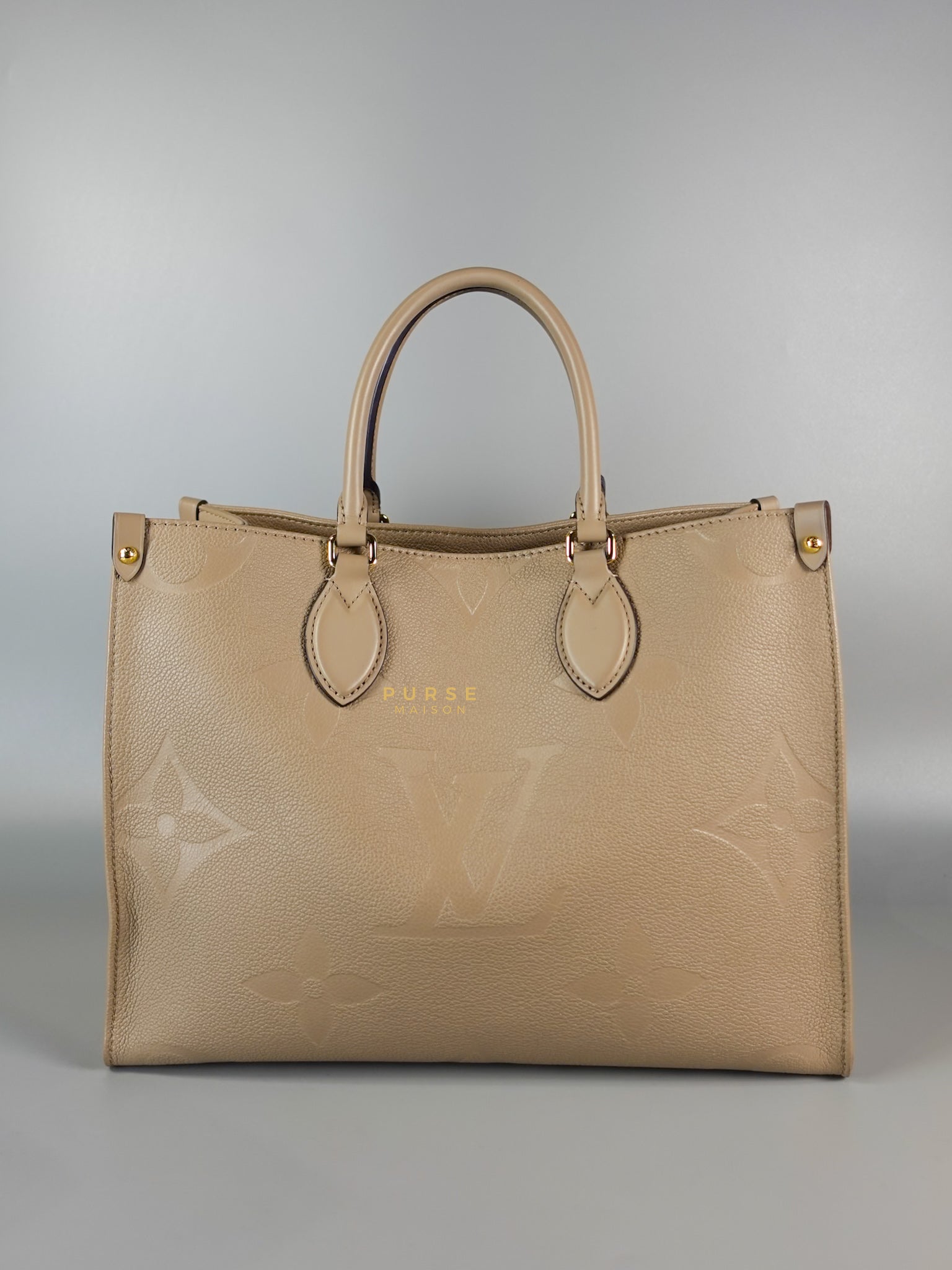 OnTheGo MM Tourterelle Empreinte Leather | Purse Maison Luxury Bags Shop