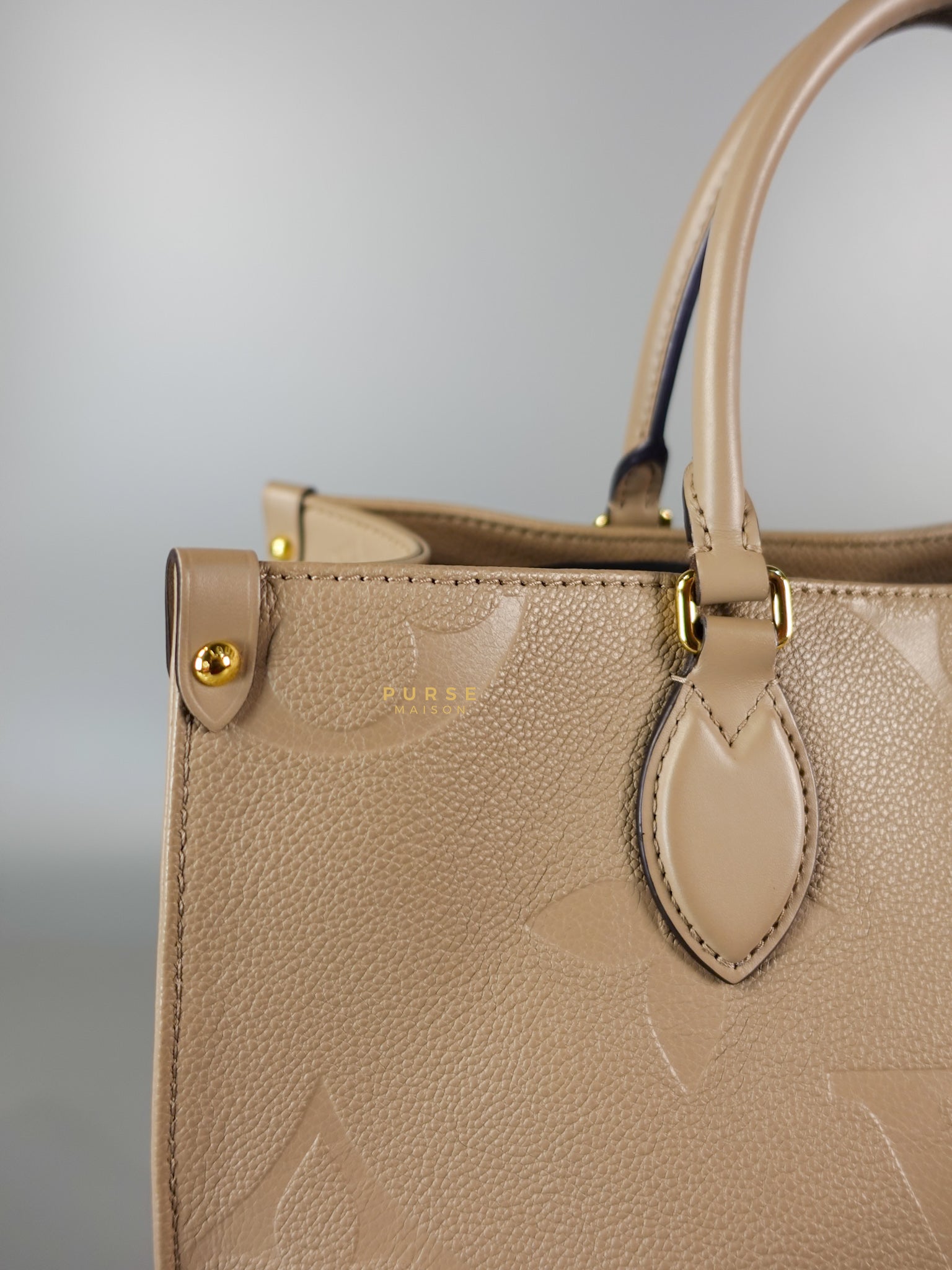 OnTheGo MM Tourterelle Empreinte Leather | Purse Maison Luxury Bags Shop