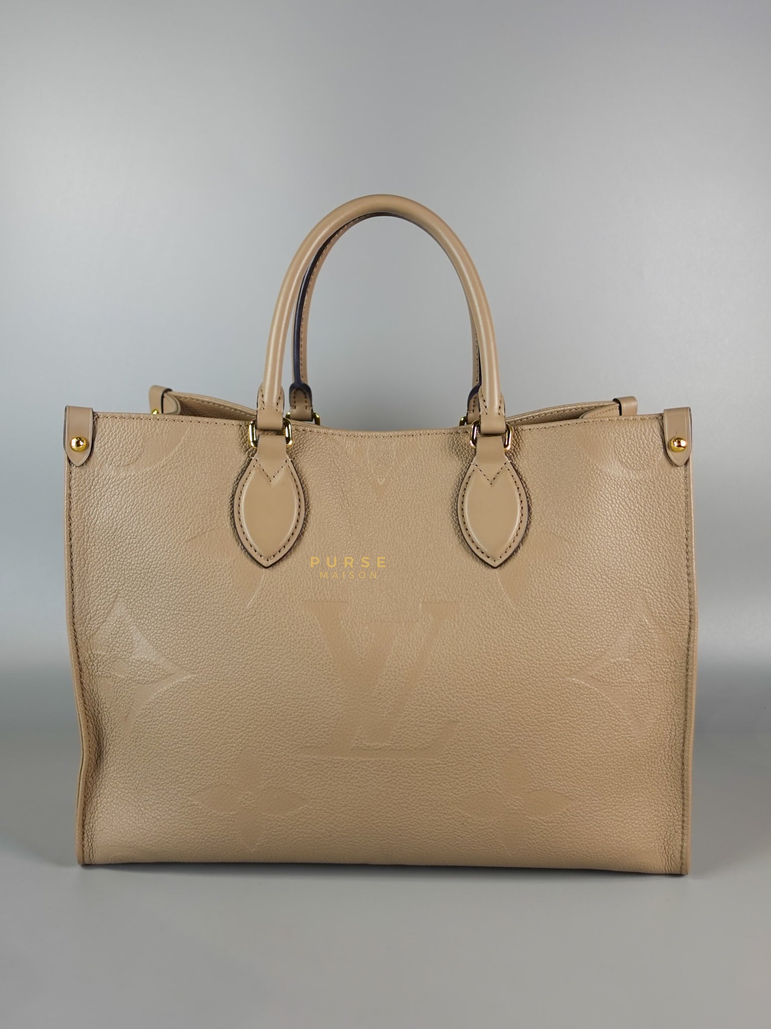 OnTheGo MM Tourterelle Empreinte Leather | Purse Maison Luxury Bags Shop