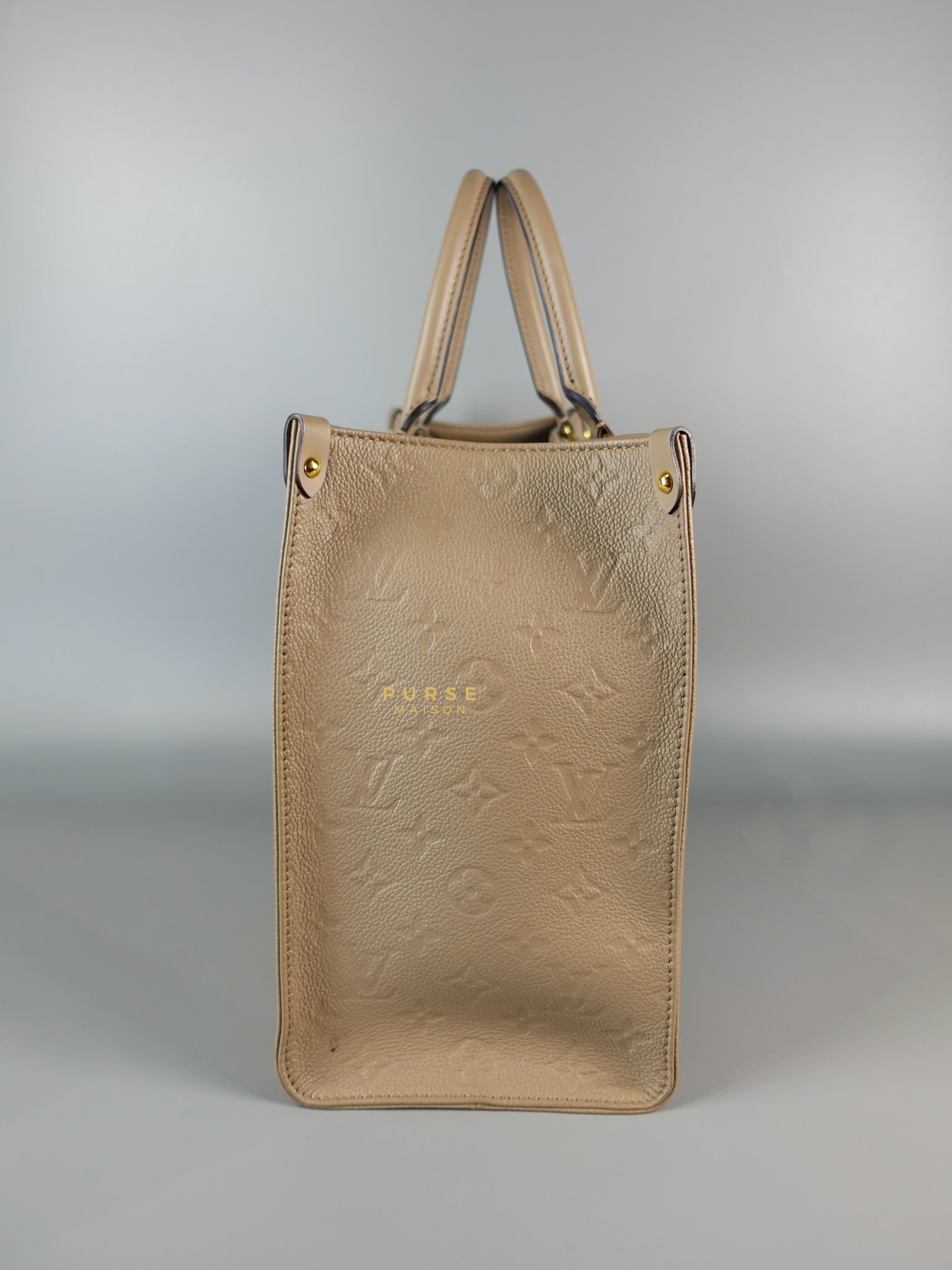 OnTheGo MM Tourterelle Empreinte Leather | Purse Maison Luxury Bags Shop