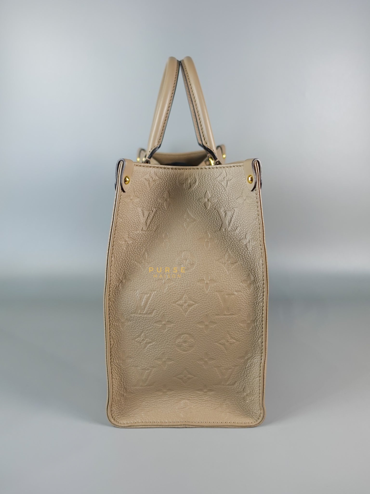 OnTheGo MM Tourterelle Empreinte Leather | Purse Maison Luxury Bags Shop