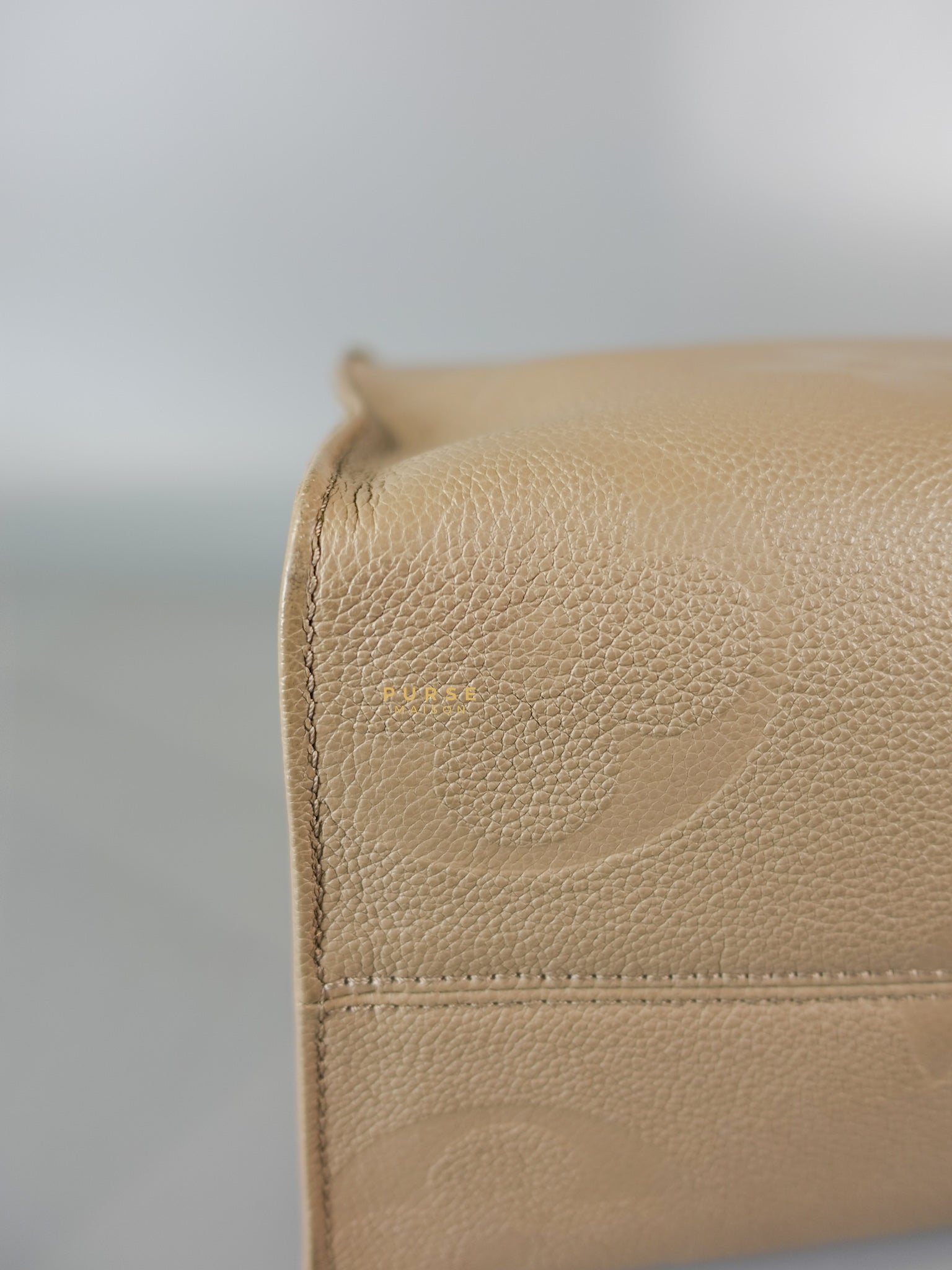 OnTheGo MM Tourterelle Empreinte Leather | Purse Maison Luxury Bags Shop