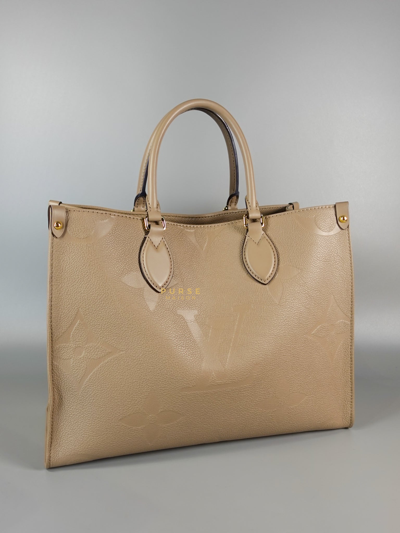 OnTheGo MM Tourterelle Empreinte Leather | Purse Maison Luxury Bags Shop