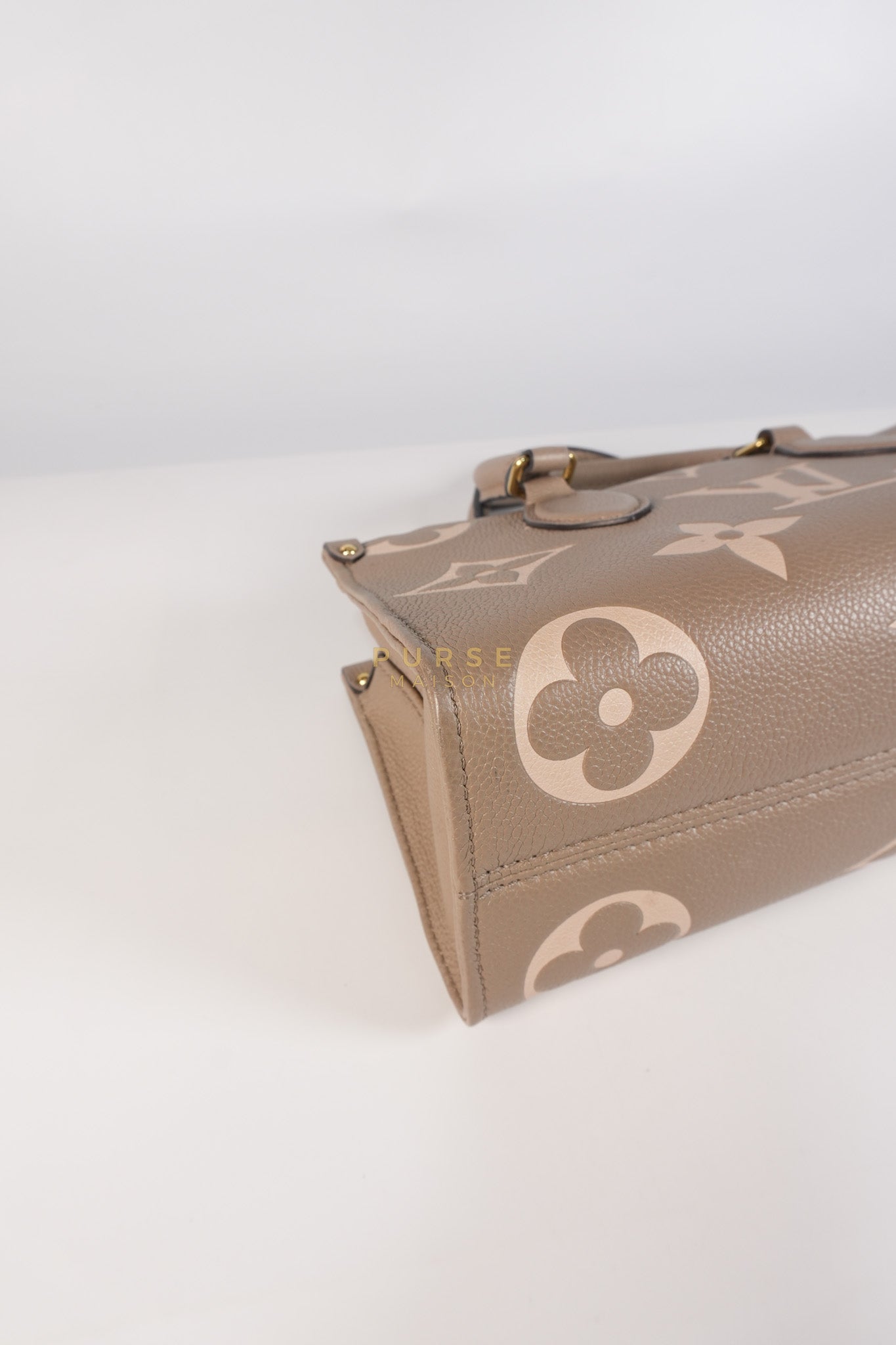 OnTheGo (OTG) East West Bi-color Empriente Leather (Microchip) | Purse Maison Luxury Bags Shop