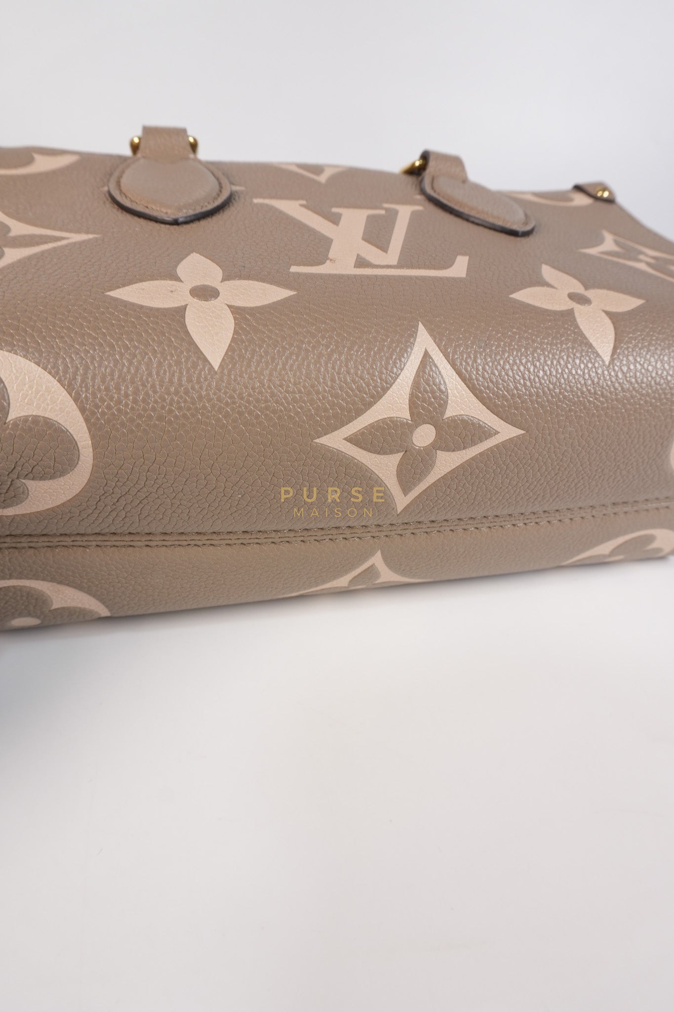 OnTheGo (OTG) East West Bi-color Empriente Leather (Microchip) | Purse Maison Luxury Bags Shop