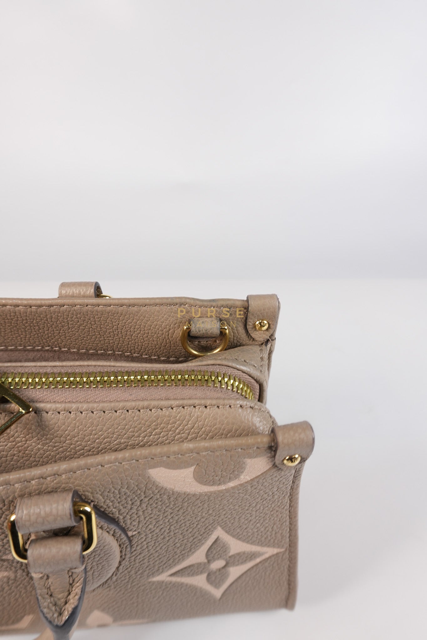 OnTheGo (OTG) East West Bi-color Empriente Leather (Microchip) | Purse Maison Luxury Bags Shop