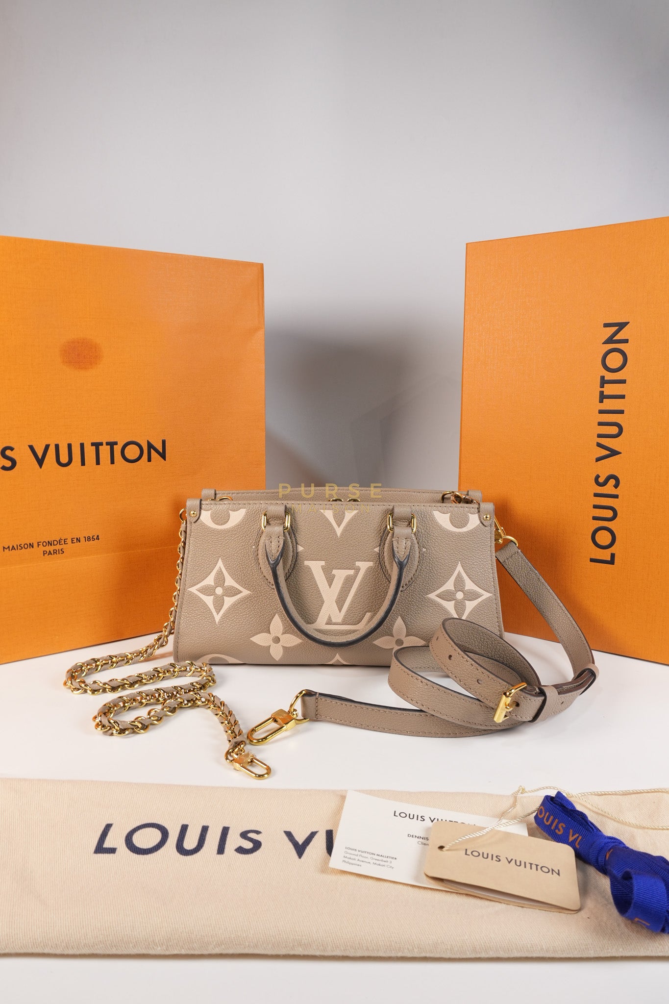 OnTheGo (OTG) East West Bi-color Empriente Leather (Microchip) | Purse Maison Luxury Bags Shop