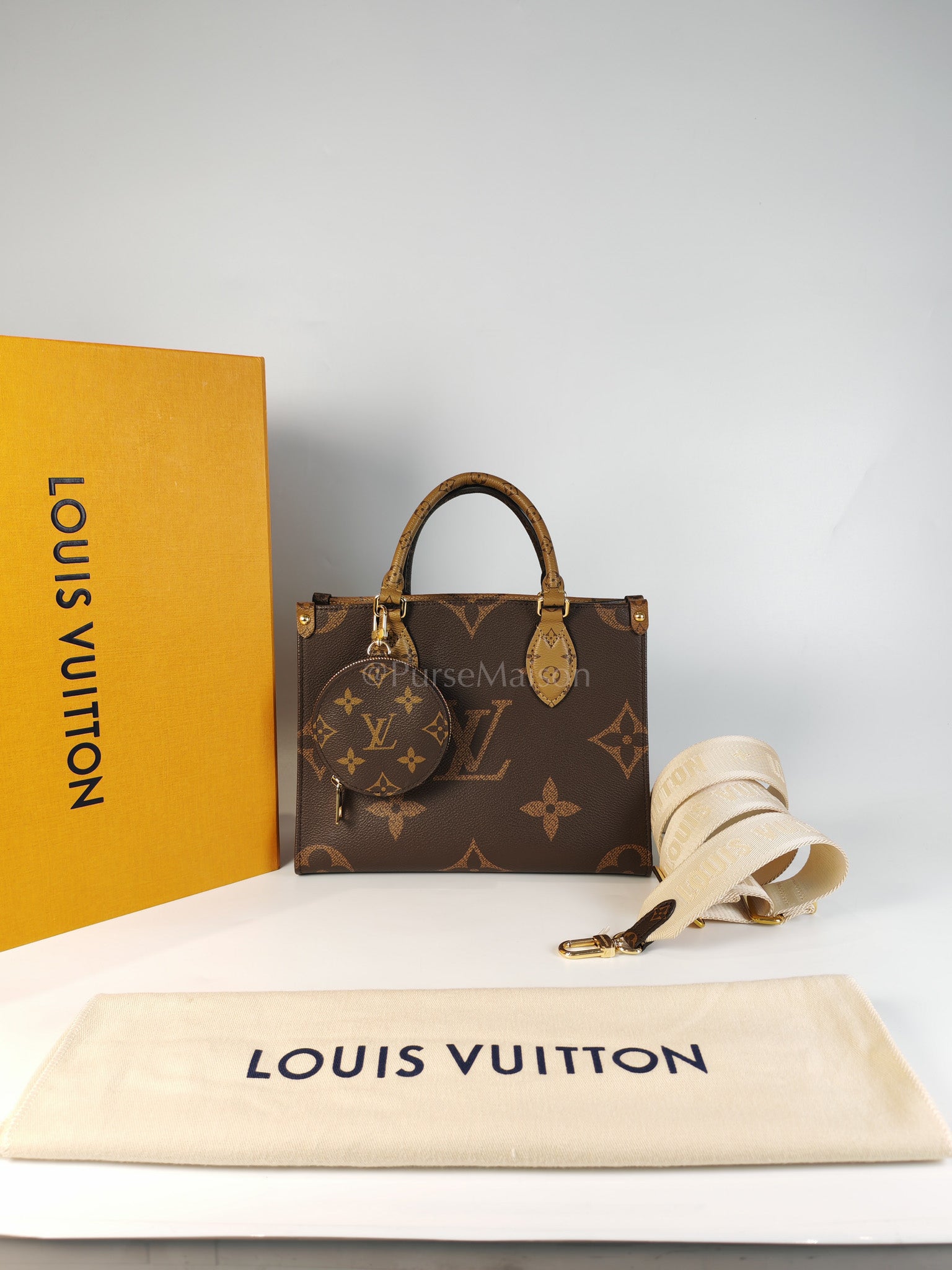 OnTheGo PM (OTG) in Reverse Monogram Canvas (Microchip) | Purse Maison Luxury Bags Shop