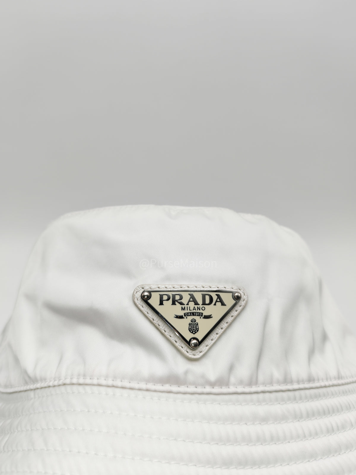 Prada Re-Nylon Bucket Hat in White with Signature Enameled Metal Triangle Logo | Purse Maison Luxury Bags Shop