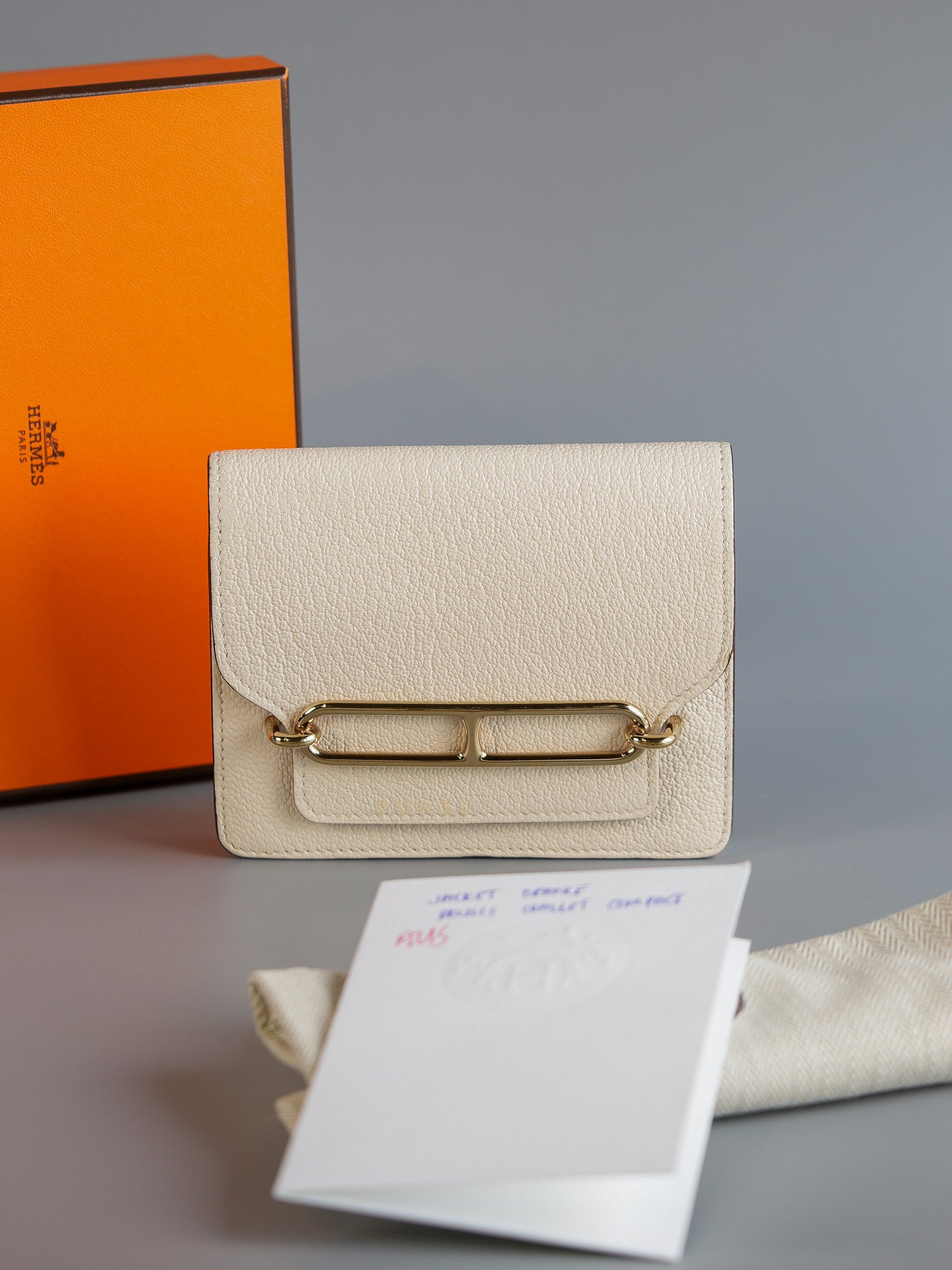 Roulis Slim Compact in Nata Chevre Mysore Leather Stamp B (2023) | Purse Maison Luxury Bags Shop