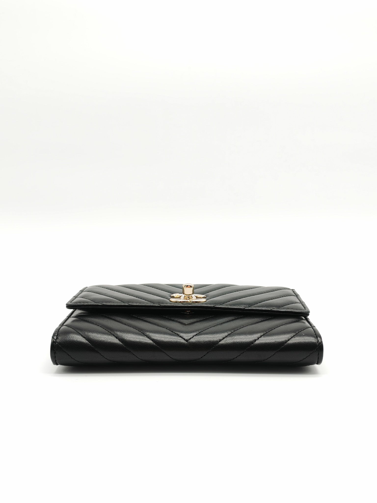 Trendy CC Wallet On Chain (WOC) in Black Chevron Lambskin Leather and Light Gold Hardware Series 25 | Purse Maison Luxury Bags Shop