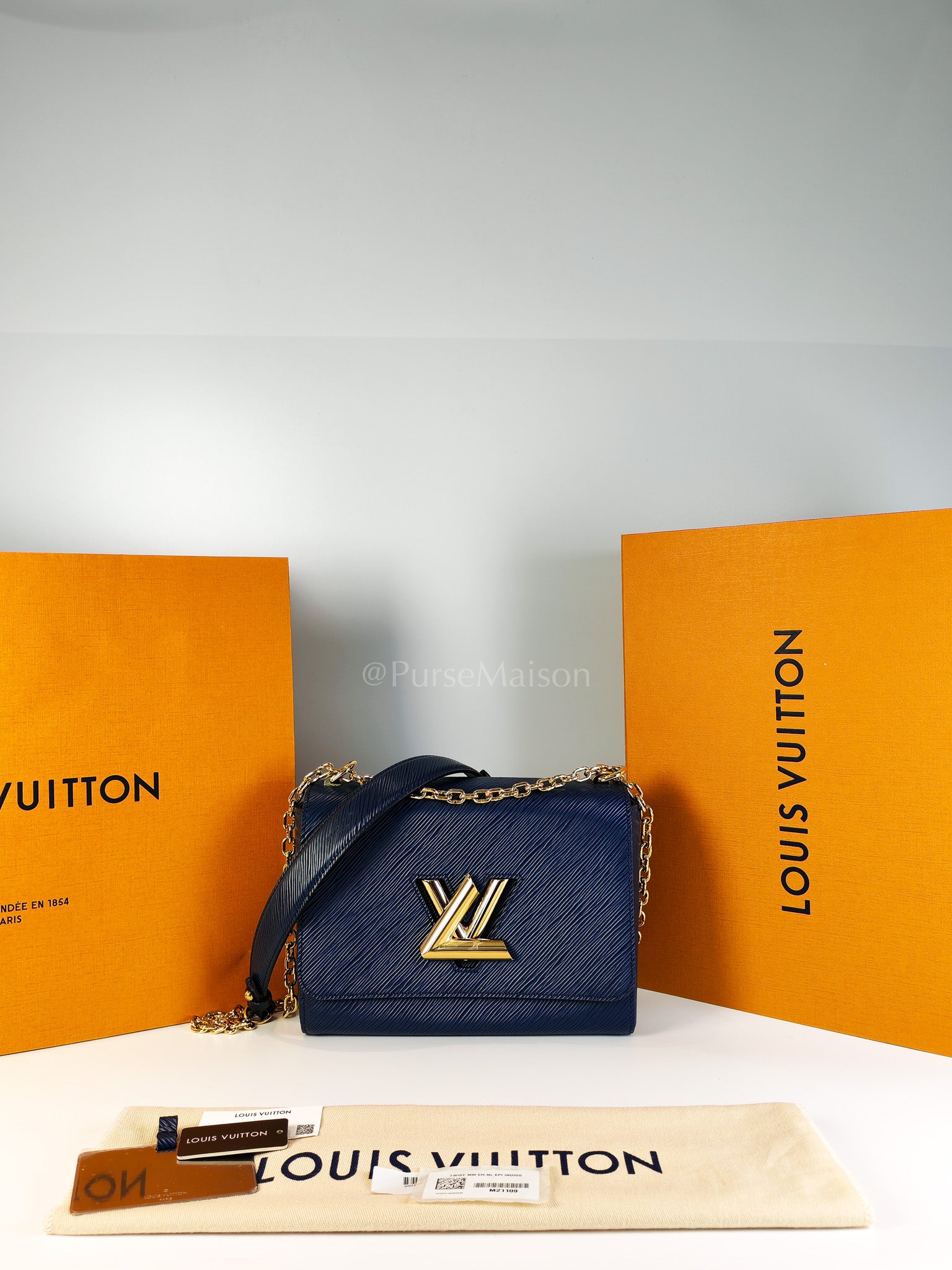 Twist Lock MM in Indigo Epi Leather and Gold Hardware (Microchip) | Purse Maison Luxury Bags Shop