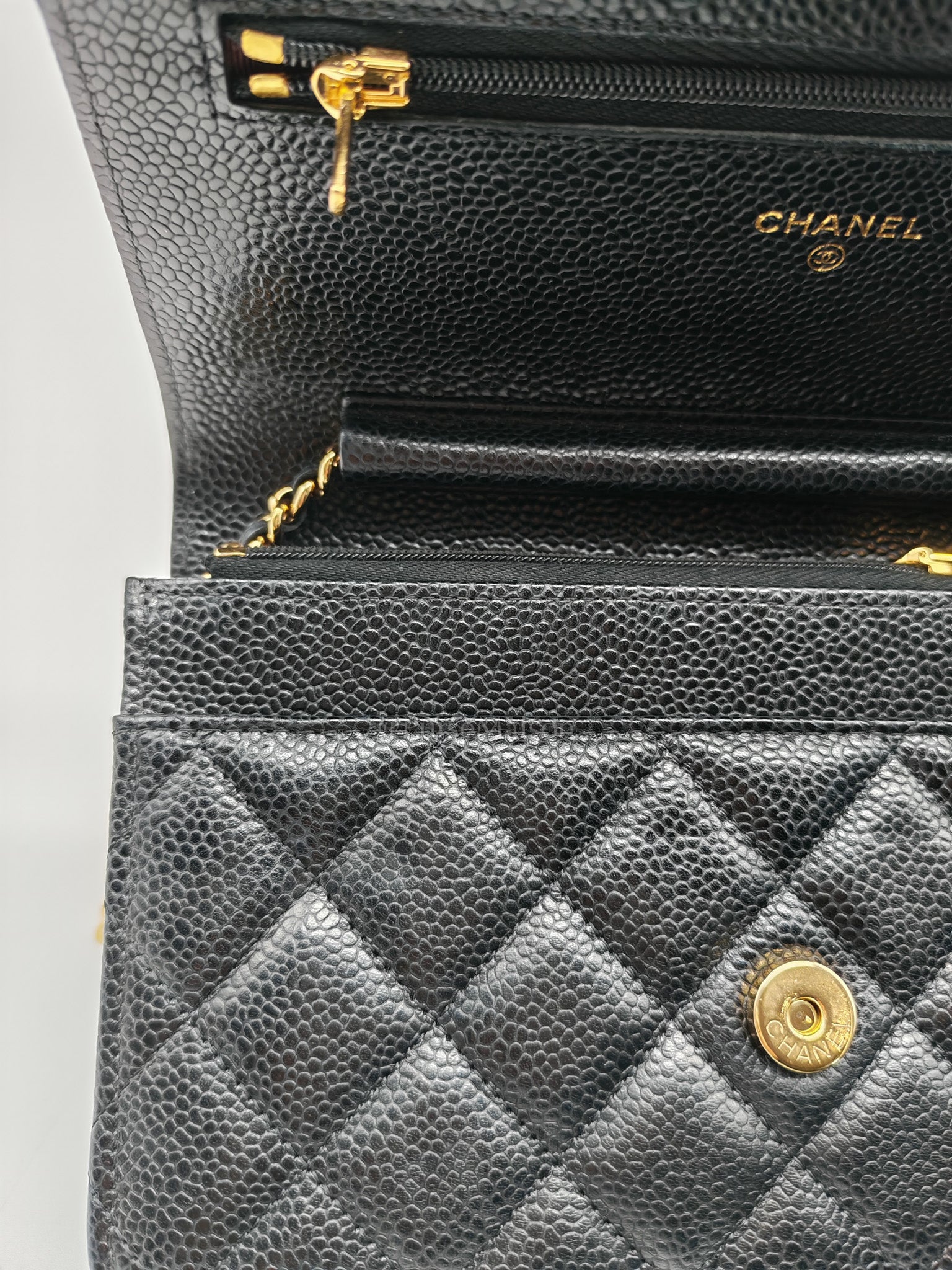Wallet On Chain (WOC) in Black Quilted Caviar Leather and Gold Hardware Microchip