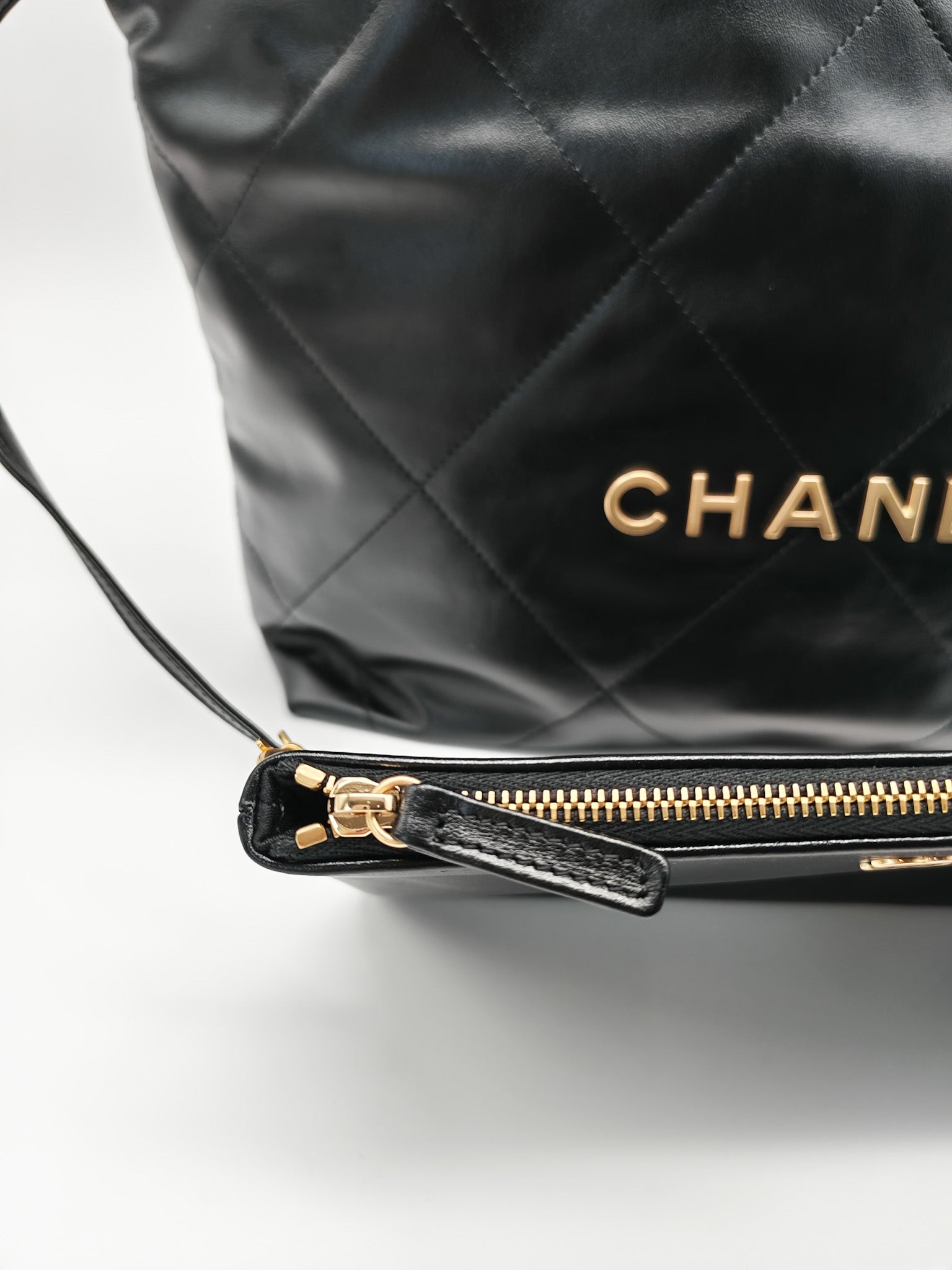 22 Small in Black Quilted Shiny Calfskin Leather and Aged Gold Hardware (Microchip) | Purse Maison Luxury Bags Shop