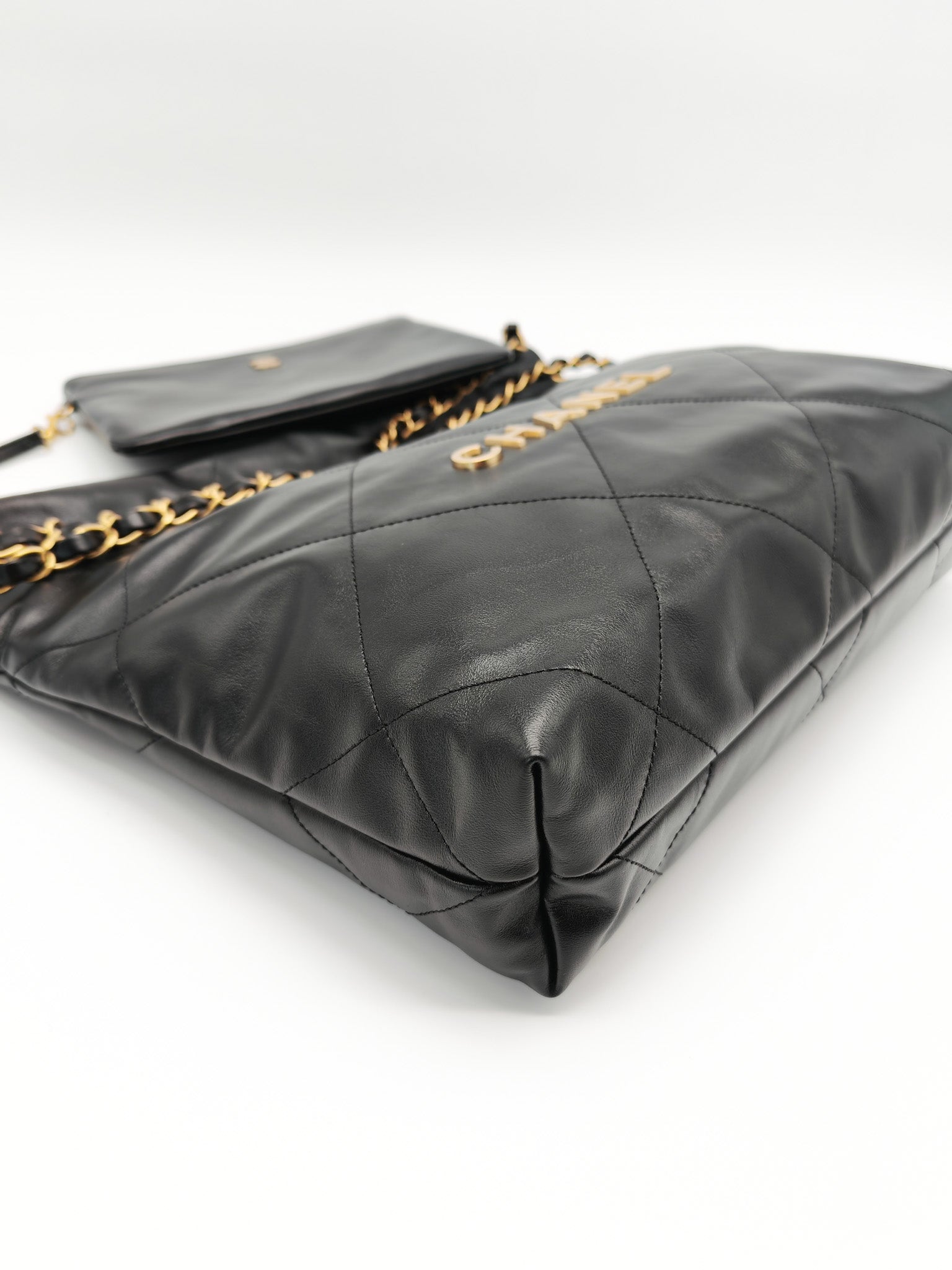 22 Small in Black Quilted Shiny Calfskin Leather and Aged Gold Hardware (Microchip) | Purse Maison Luxury Bags Shop