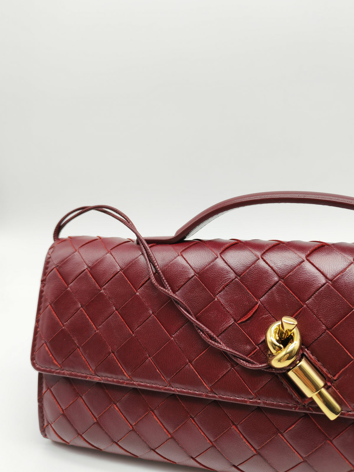 Bottega Veneta Andiamo Clutch in Barolo Woven Intrecciato Lambskin Leather and Gold Hardware