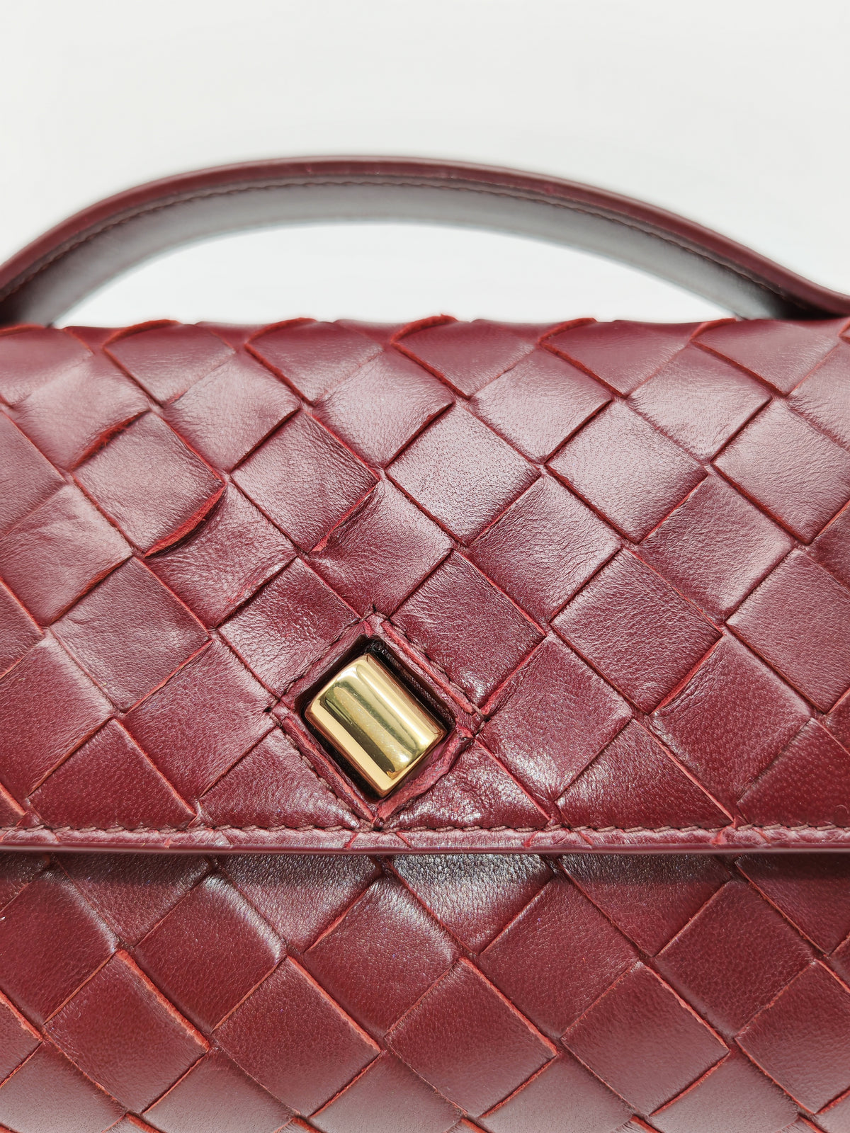 Bottega Veneta Andiamo Clutch in Barolo Woven Intrecciato Lambskin Leather and Gold Hardware