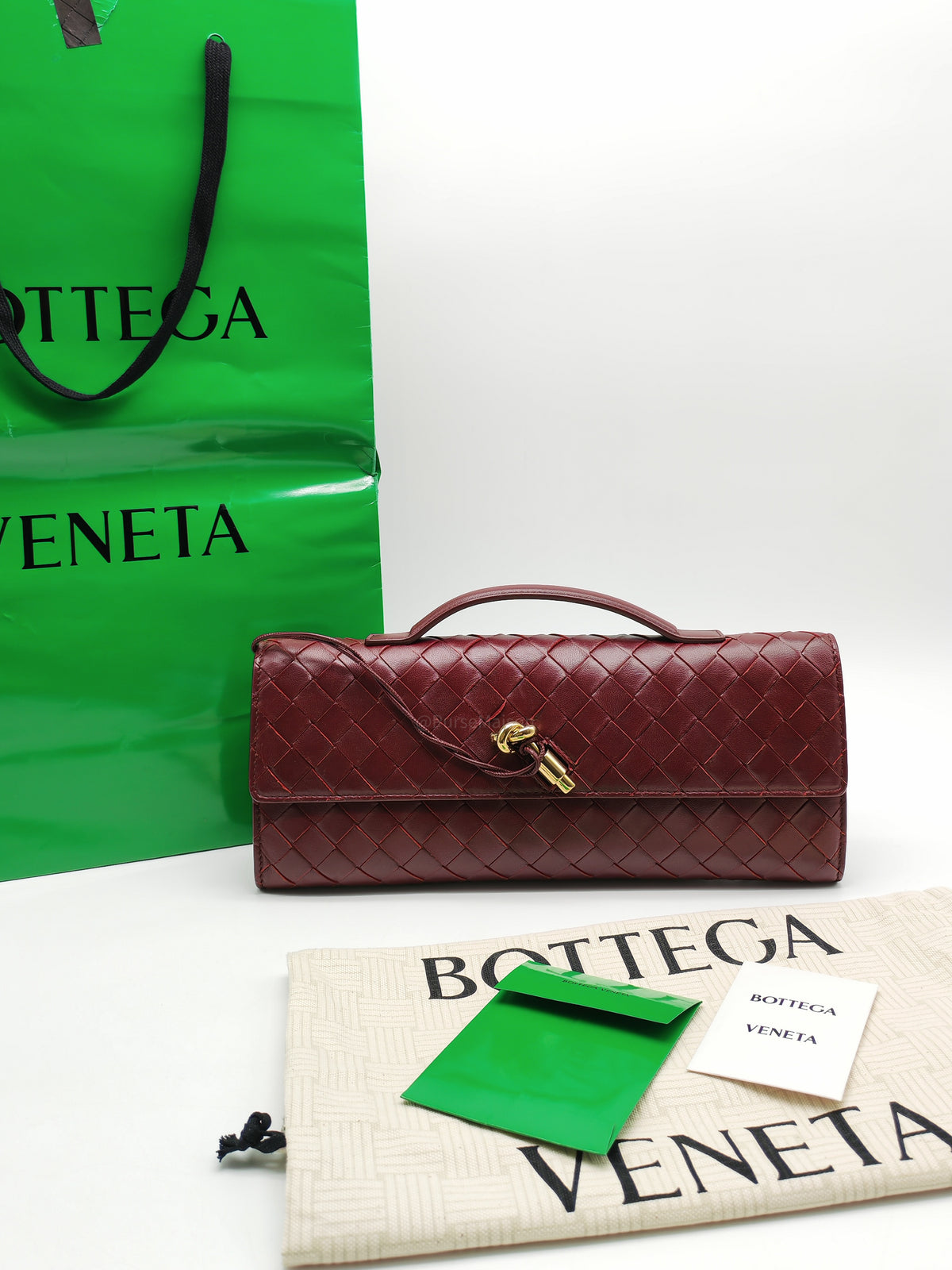 Bottega Veneta Andiamo Clutch in Barolo Woven Intrecciato Lambskin Leather and Gold Hardware