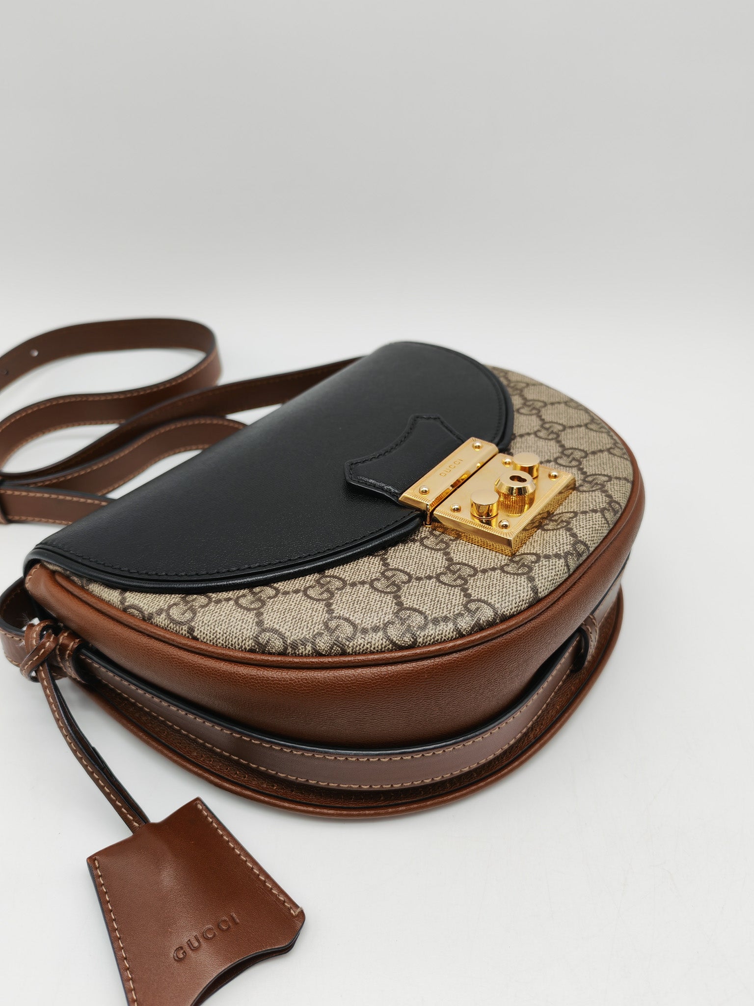 Gucci Padlock Saddle Bag in GG Supreme Monogram Canvas and Gold Hardware